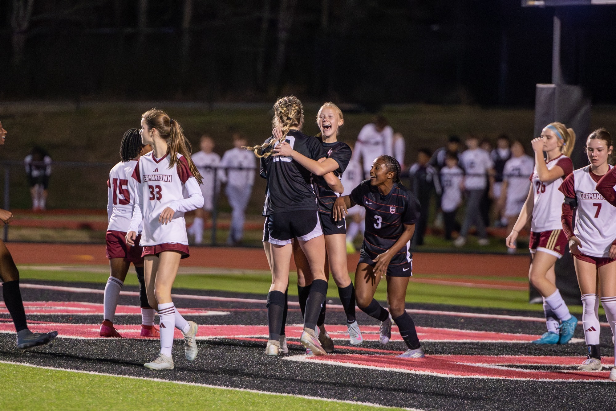The Lady Arrows celebrate Alex Holmes' goal in the second half of a Region 2-7A game against the Germantown Lady Mavericks on January 13 at Arrow Field.