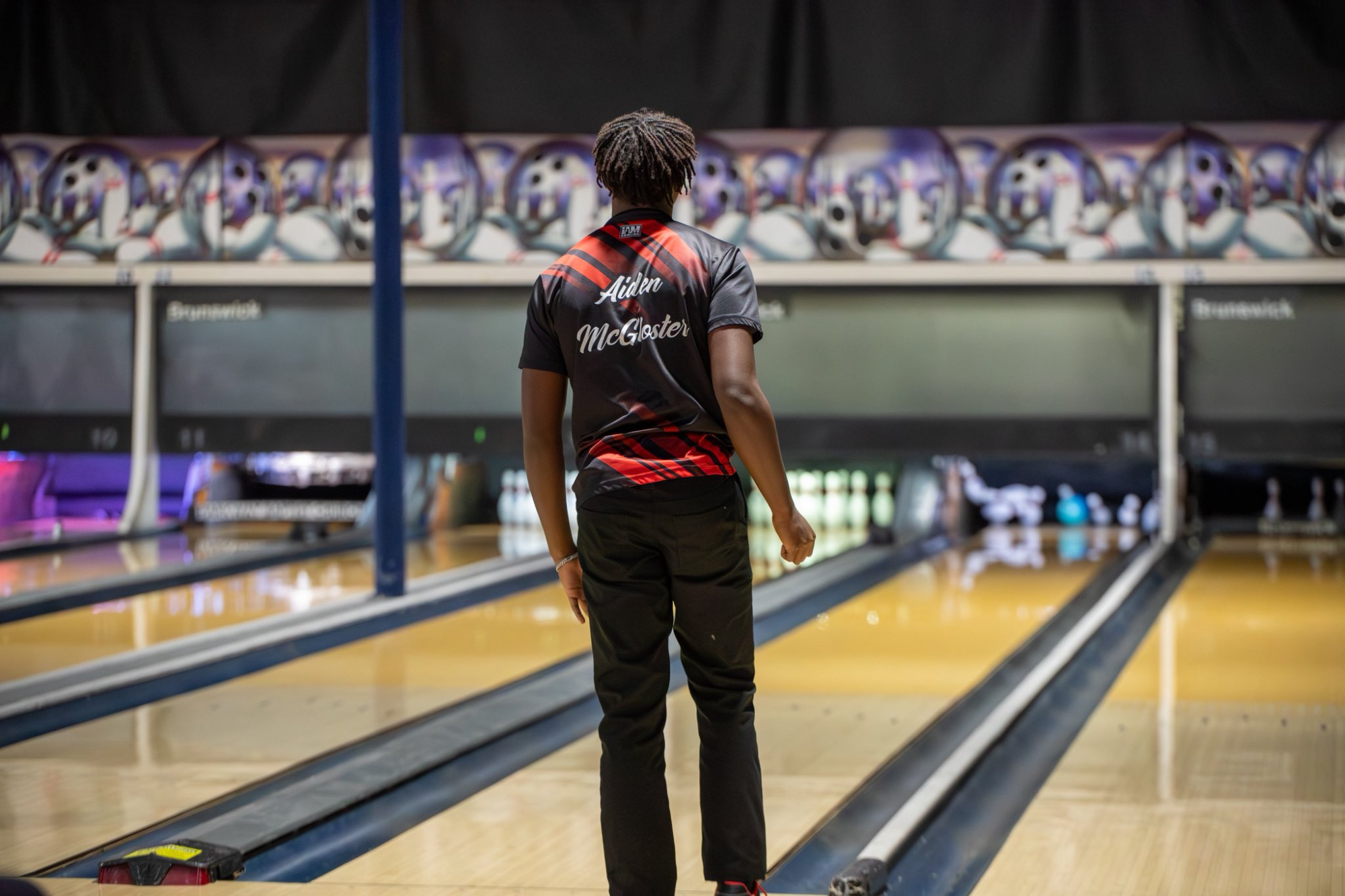 Aiden McGloster watches his roll end in a strike on Thursday, January 15, at Indian Lanes in Clinton.