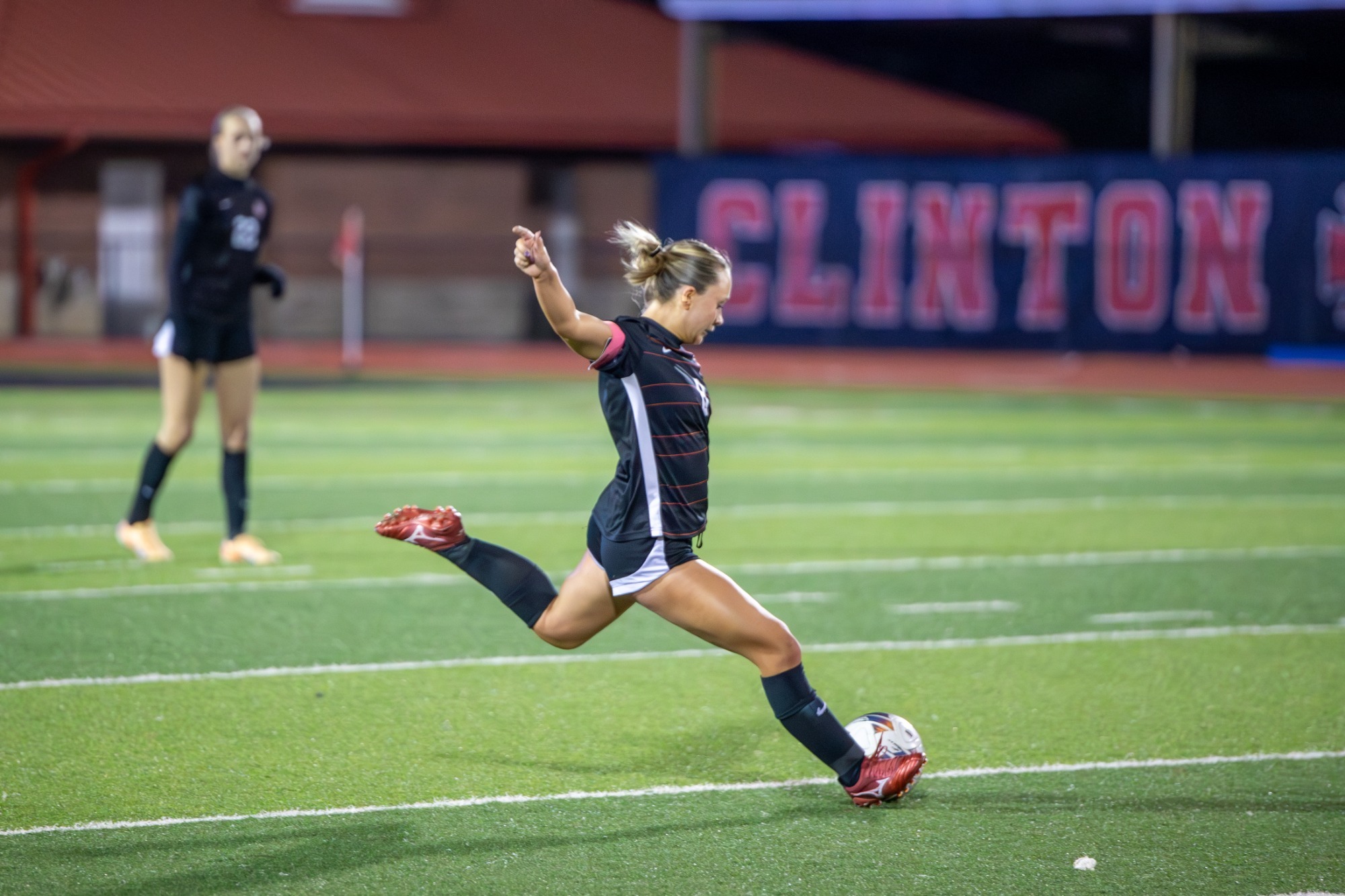 Ruby Acy clears the Lady Arrow back line.