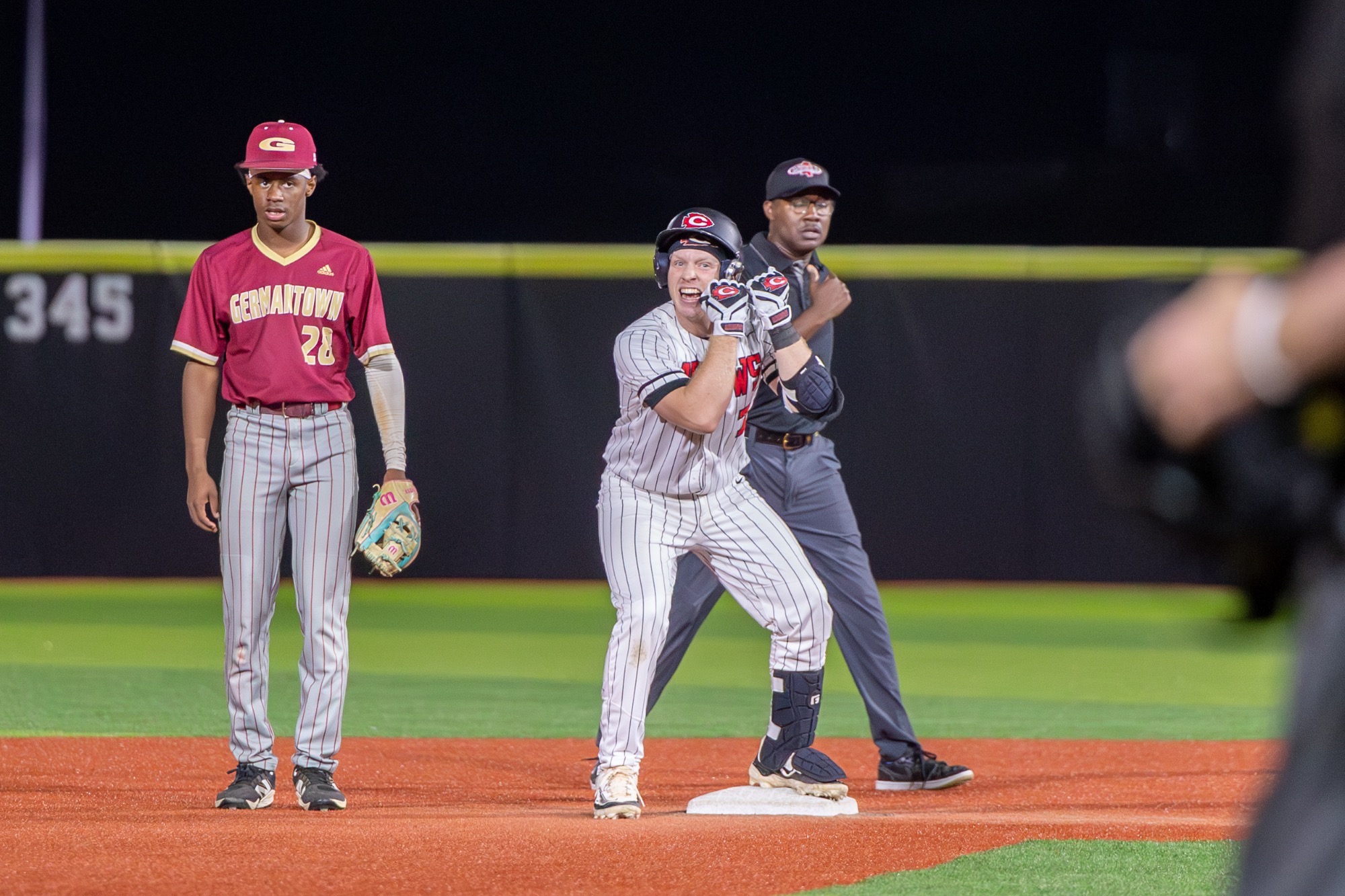 Stone Crain celebrates an RBI double against the Germantown Mavericks on Tuesday, March 3, at Arrow Baseball Field.