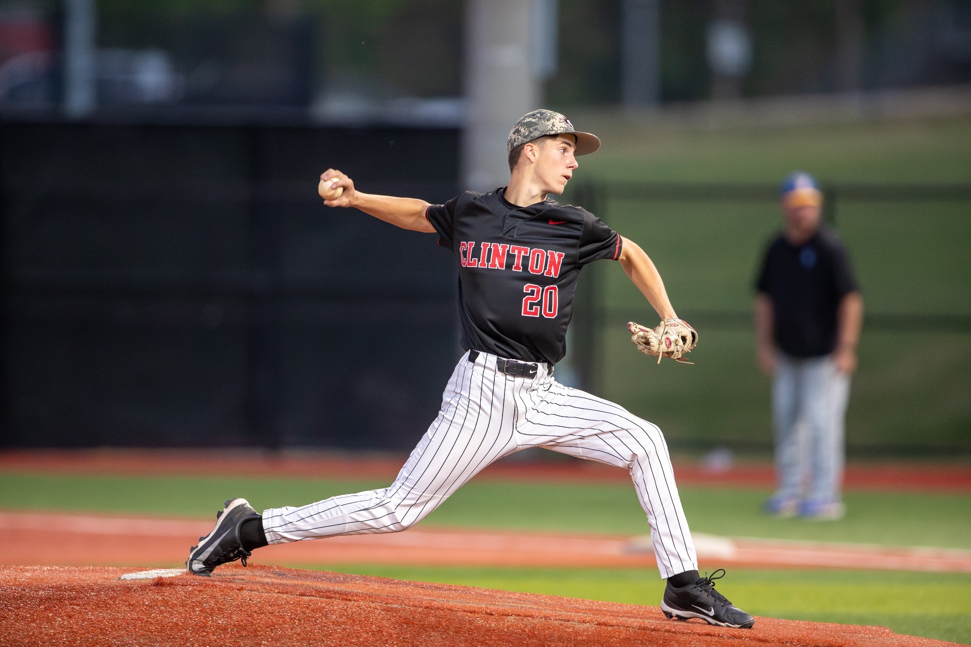 Freshman Walker Jackson hurls a pitch against the Oxford Chargers on Tuesday, March 31, at Arrow Baseball Field.
