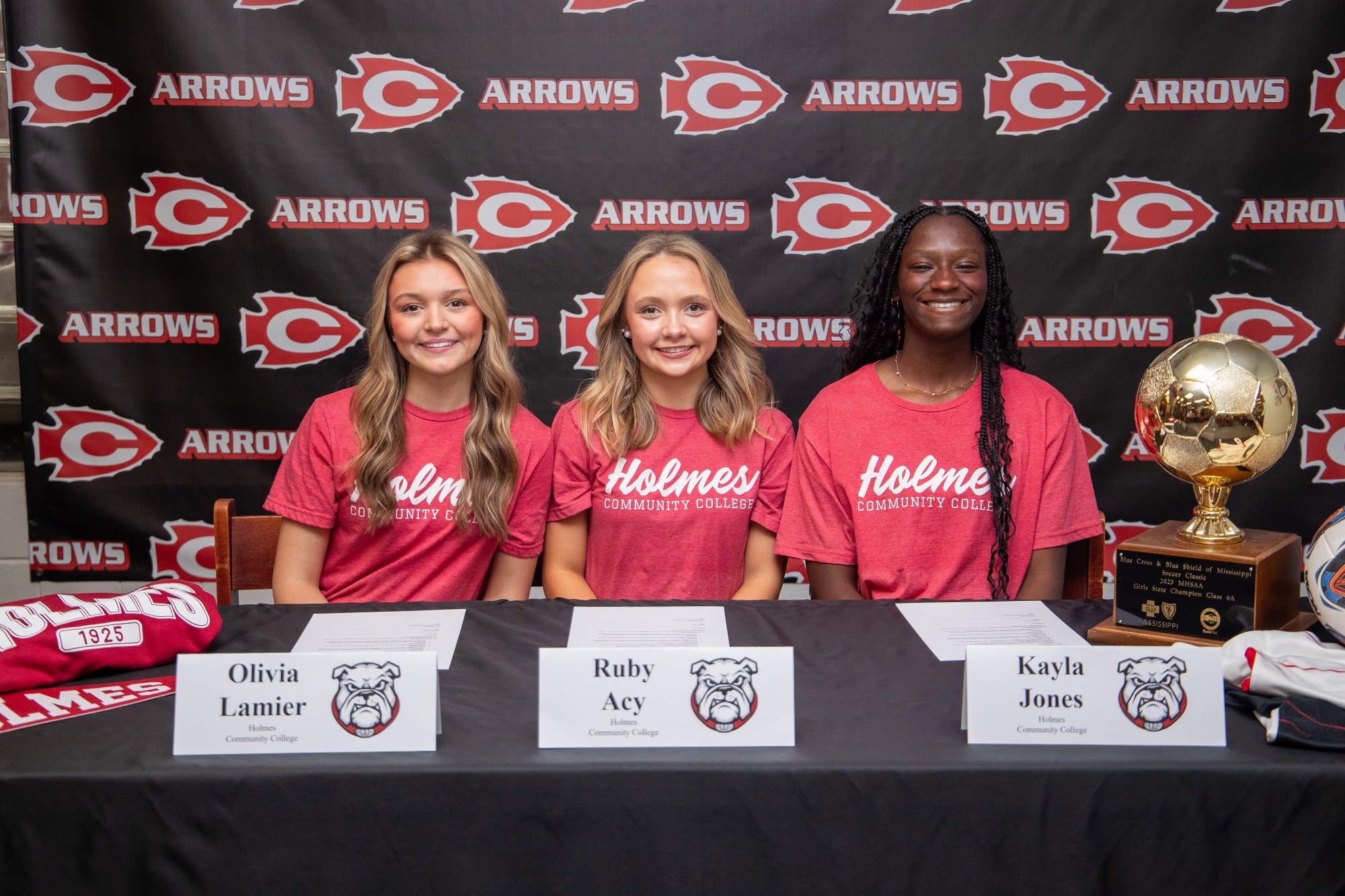Clinton Lady Arrow soccer players Ruby Acy, Kayla Jones, and Olivia Lamier each signed their national letters of intent to continue their soccer careers at the collegiate level during a signing ceremony held Friday, April 17, inside the Clinton High School Media Center. 