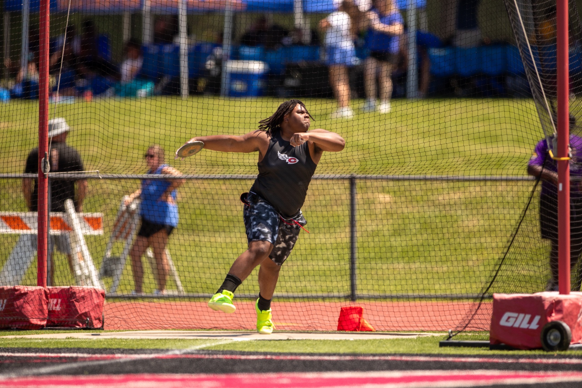 Nathan Perkins, fighting through an ankle injury, makes a discus throw at the MHSAA Class 7A North State Championships on Thursday, April 23, at Arrow Field.