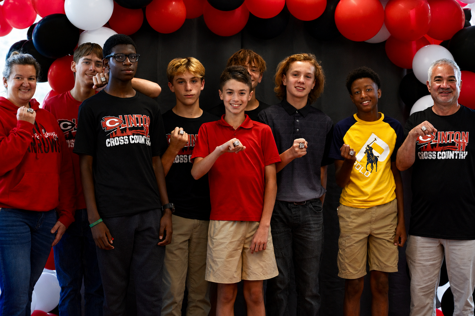 Athletes and coaches of the 2025 CJHS boys cross country team pose with their state championship rings at a ring ceremony held on Monday, May 18, at CHS.