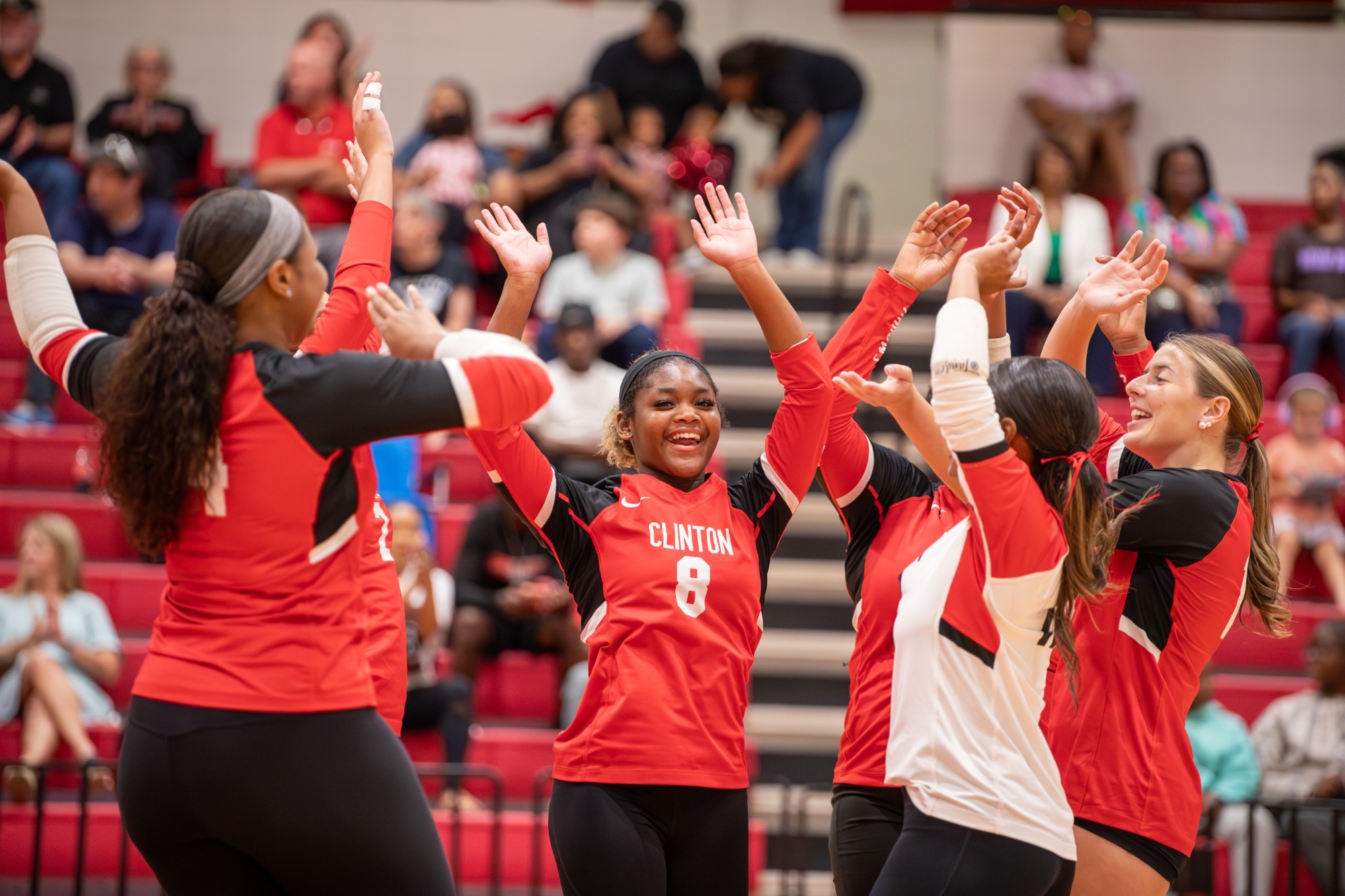 The Lady Arrow volleyball team celebrates a point during a non-district match against Ridgeland on Aug. 4 in Clinton.