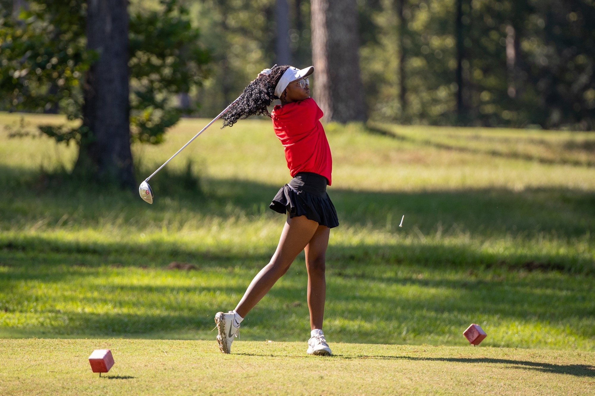 Taylar Rai Johnson takes a shot off the tee box on Thursday, September 10, at Live Oaks Golf Club in Jackson.