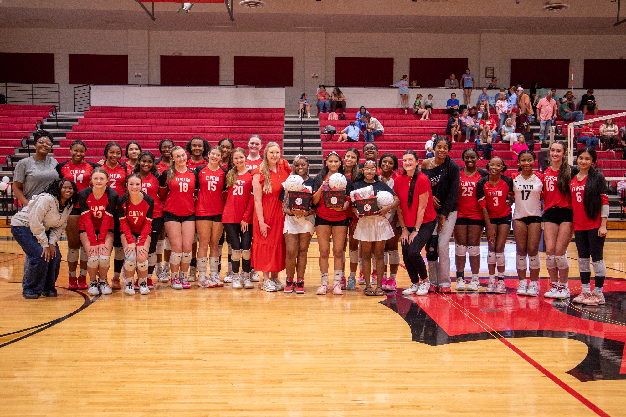 The Lady Arrow Volleyball team celebrates three of their seniors Tuesday, September 8 before their game against Warren Central.