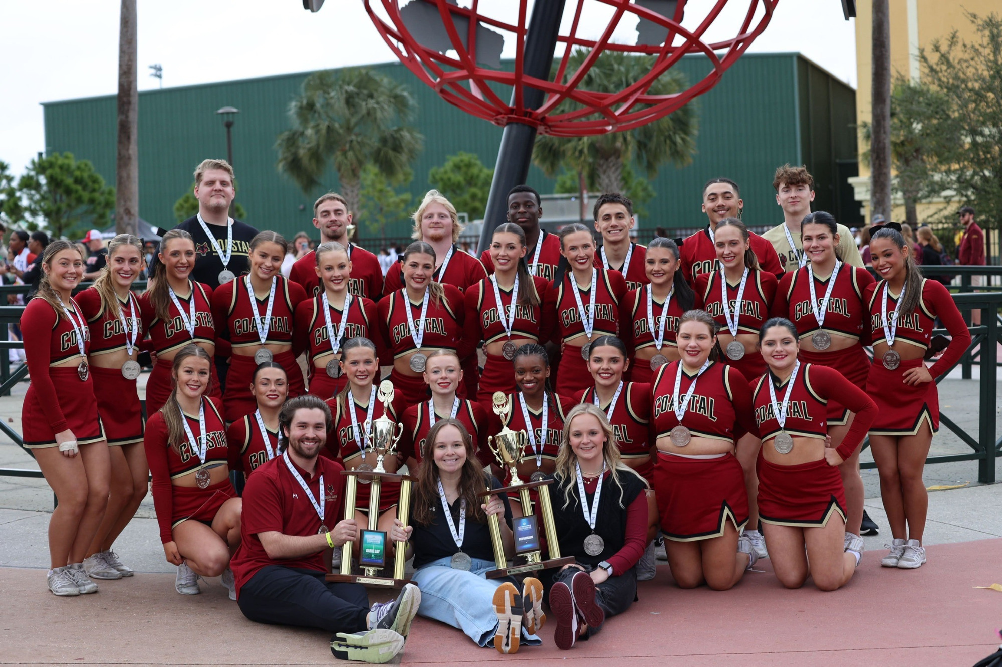 Coyotes Cheer Posing at Nationals with trophies