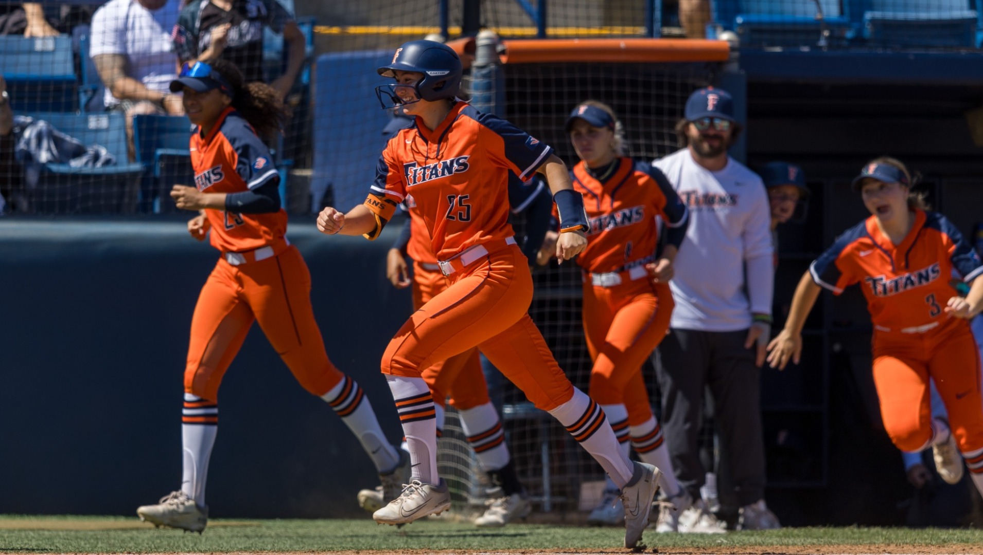 Cal State Fullerton softball team celebrating championship win