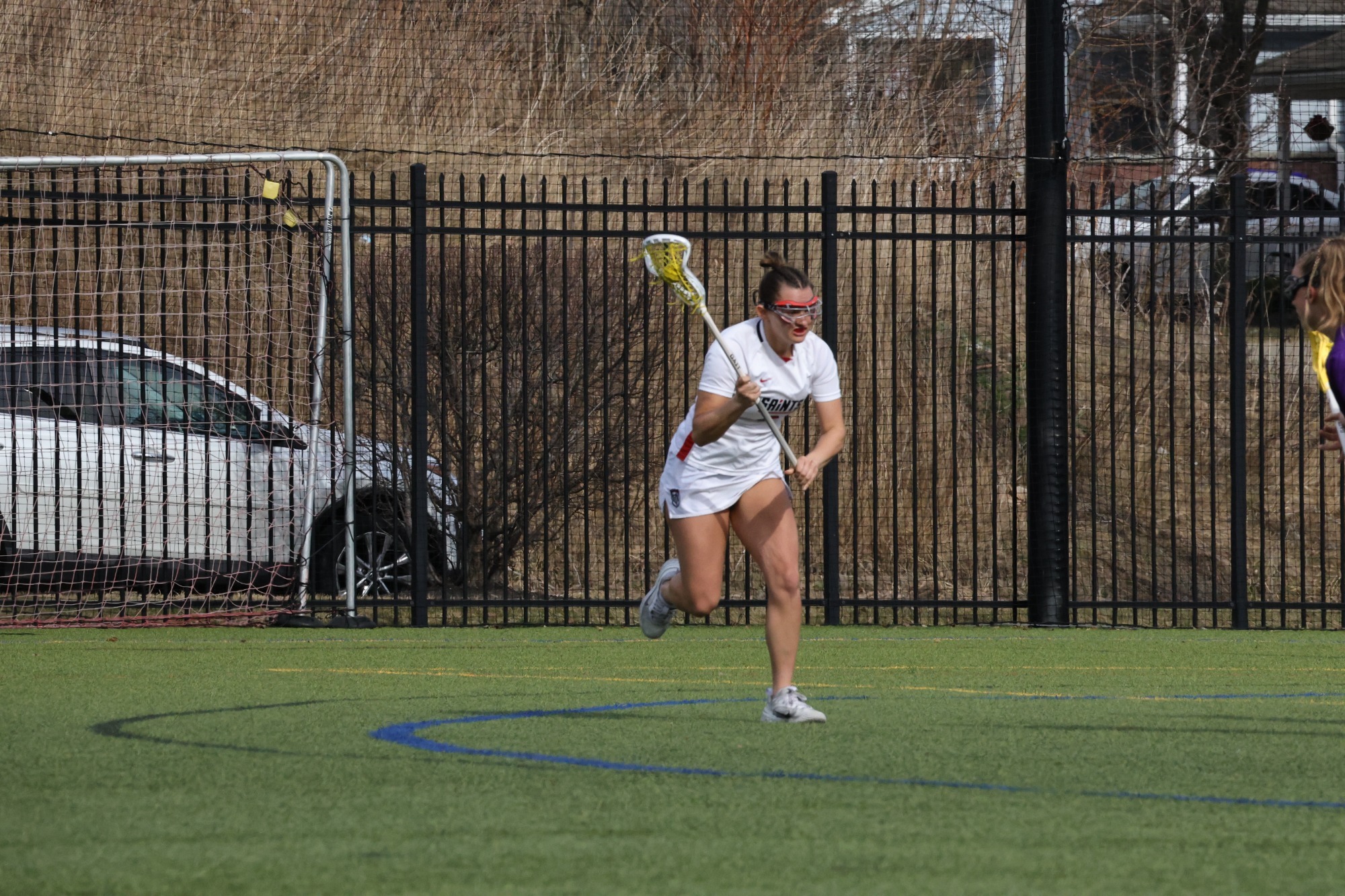 Handley driving to the net