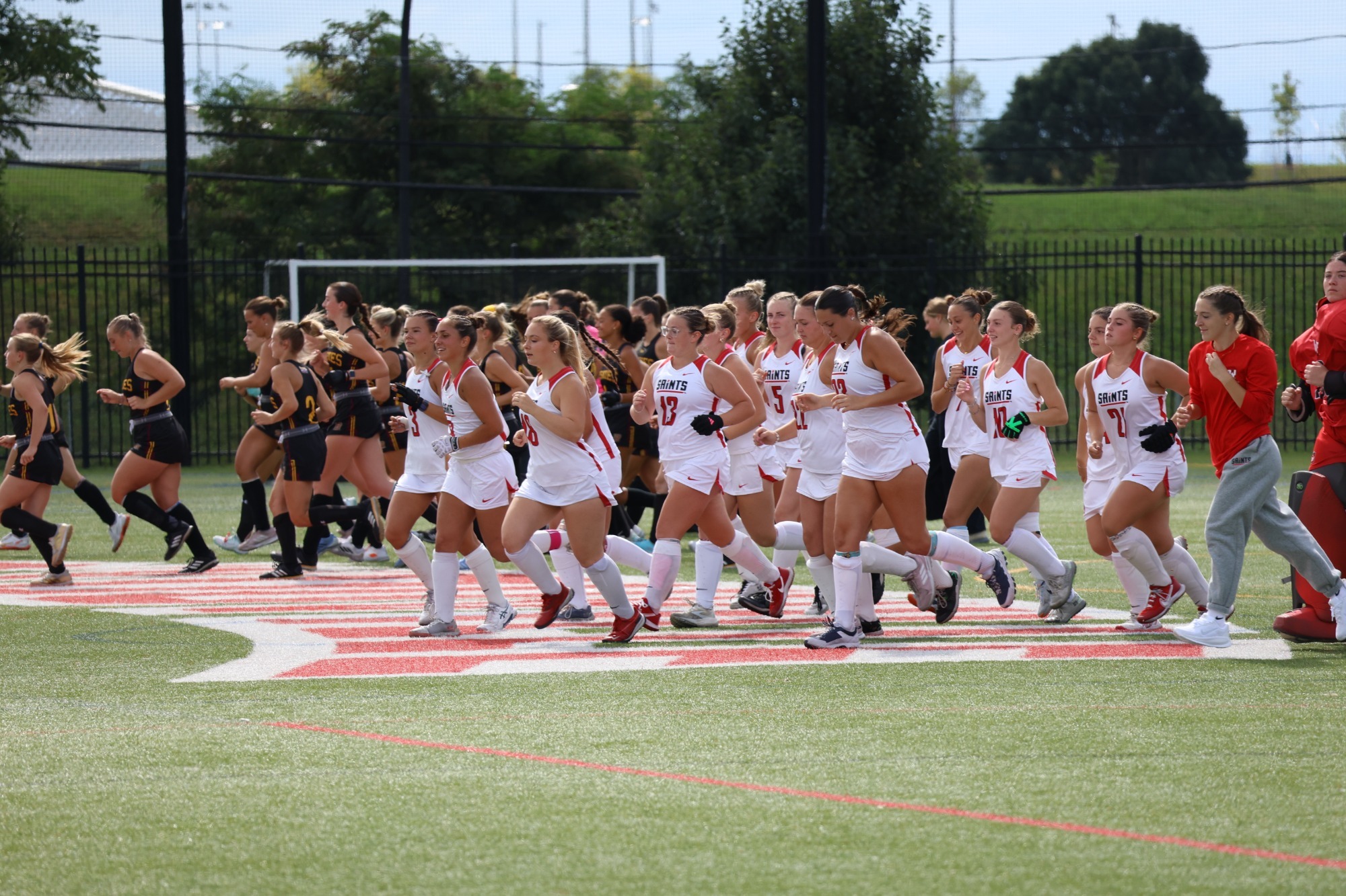 Field Hockey Runs Off the Field Prior to Game Start Time
