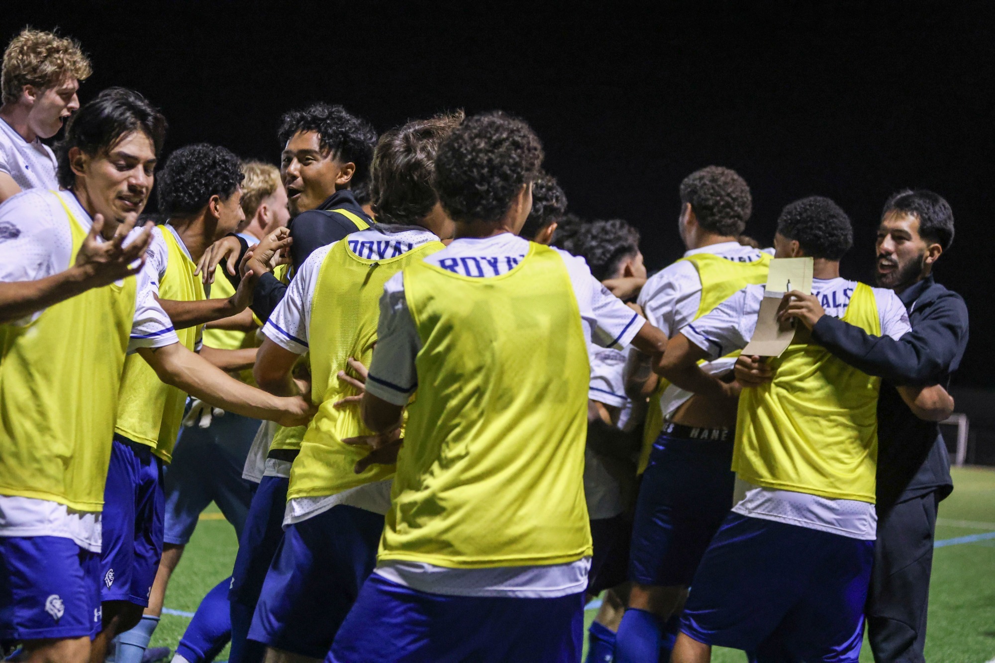 Men's Soccer Team Celebrating Goal vs. RMC 2025
