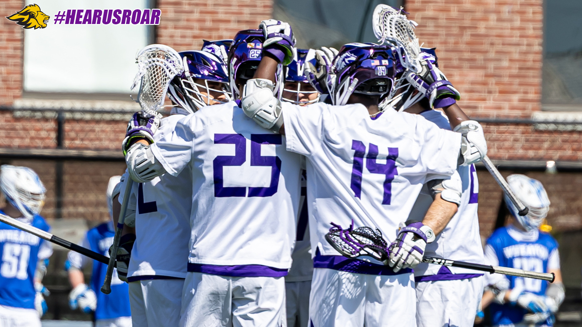 Men's Lacrosse huddle vs Wheaton