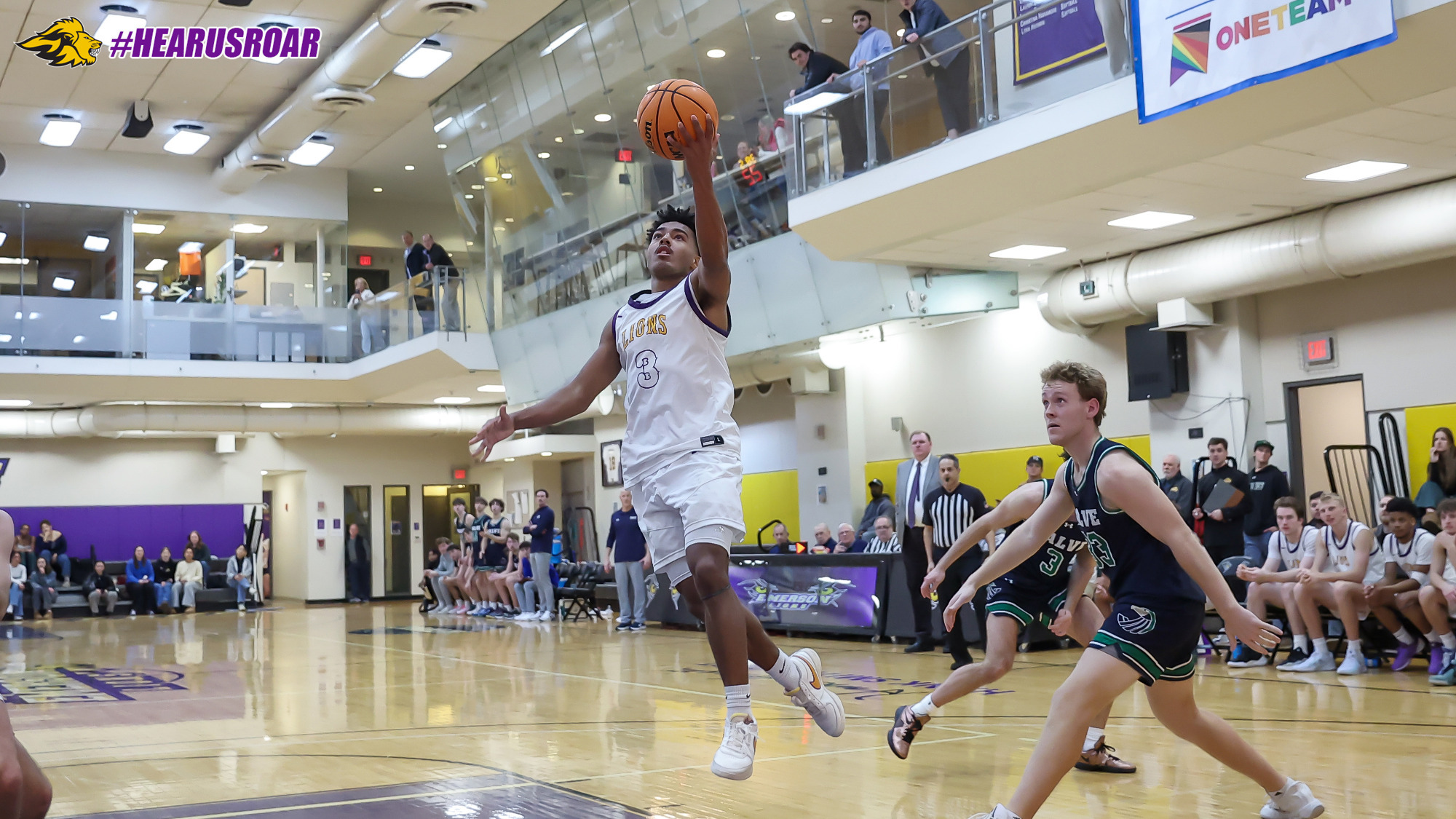Jacob Armant drives to the basket against Salve Regina