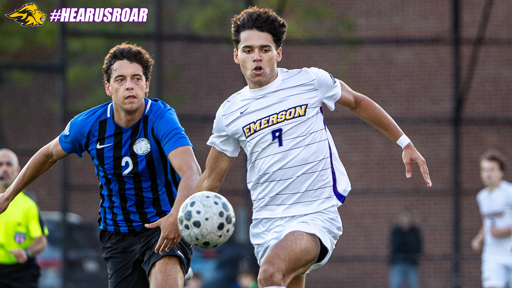 Carlo Carson fends off a defender against Wheaton