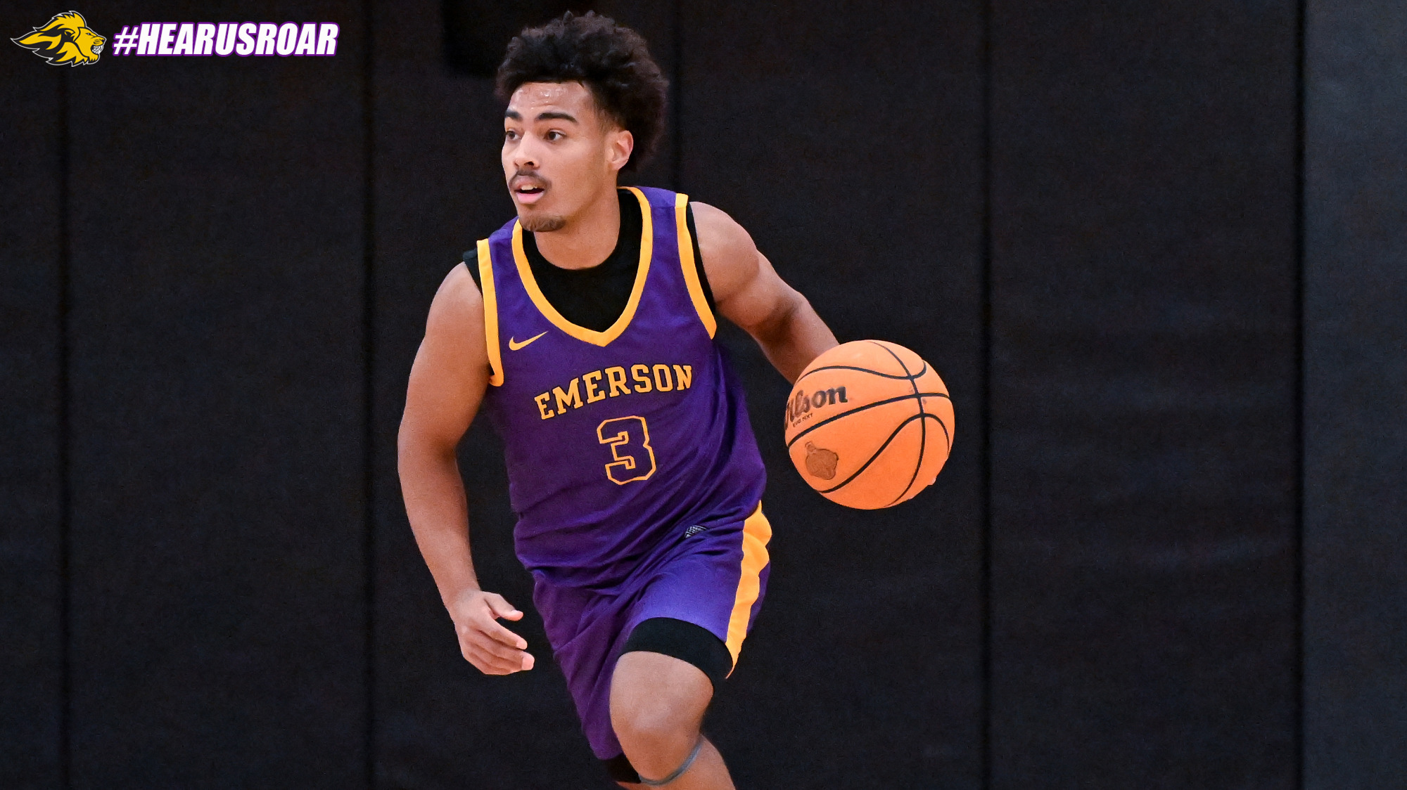 Jacob Armant dribbles up court at WPI