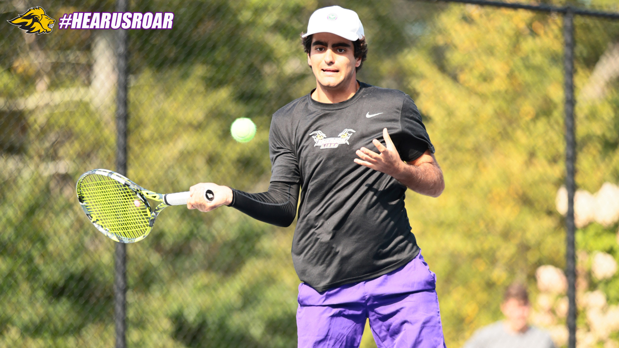 Adam Alireza hits a fore hand shot