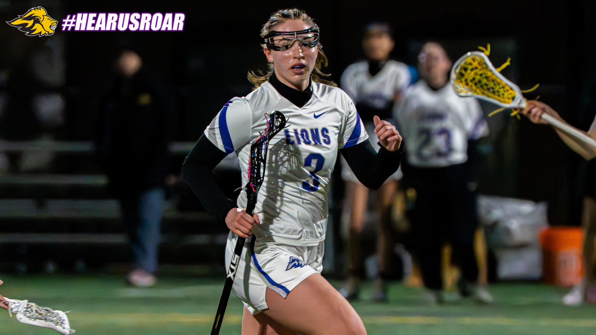 Laura Lovell looks for space against UMass Boston