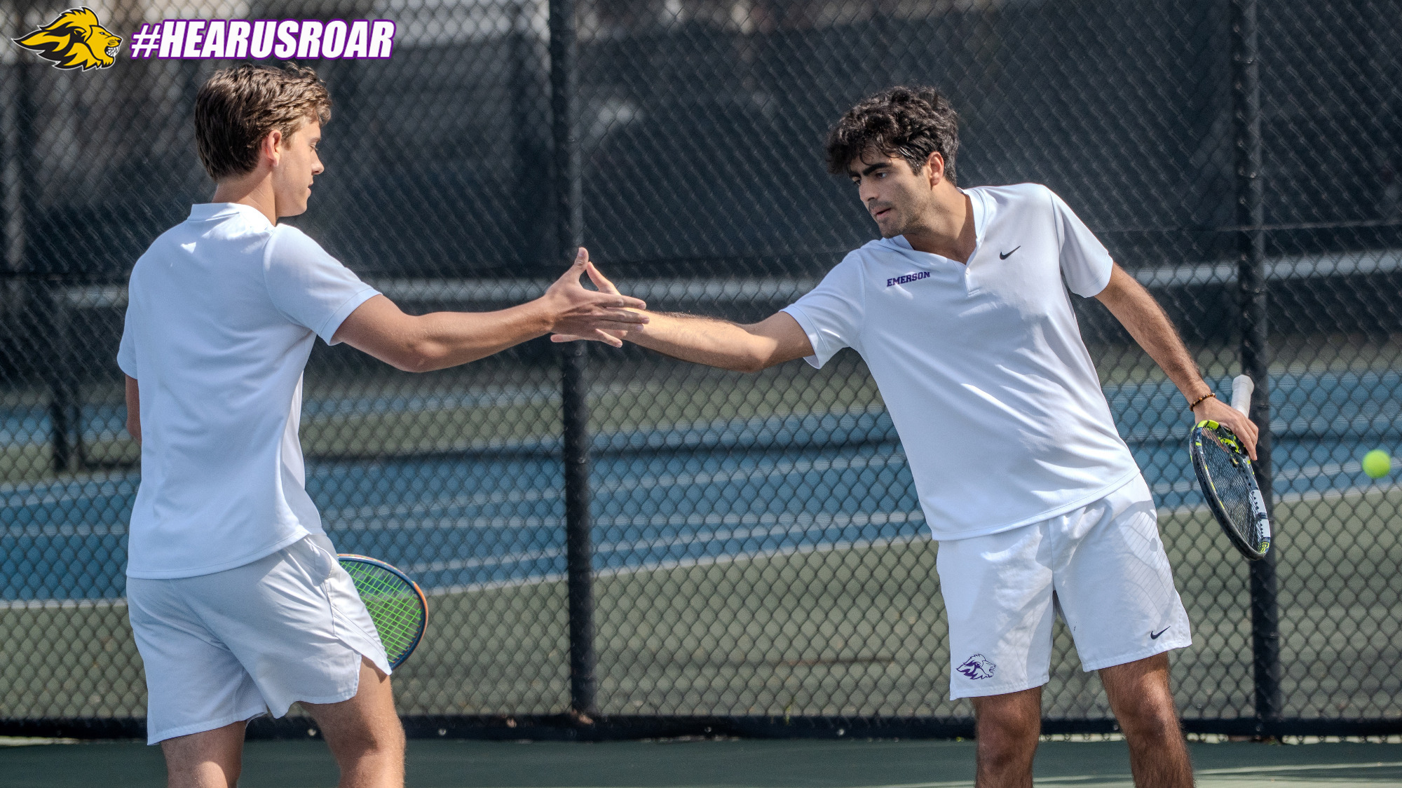 Adam Alireza and Caiden Riebold high five after a point at No. 3 doubles against Clark