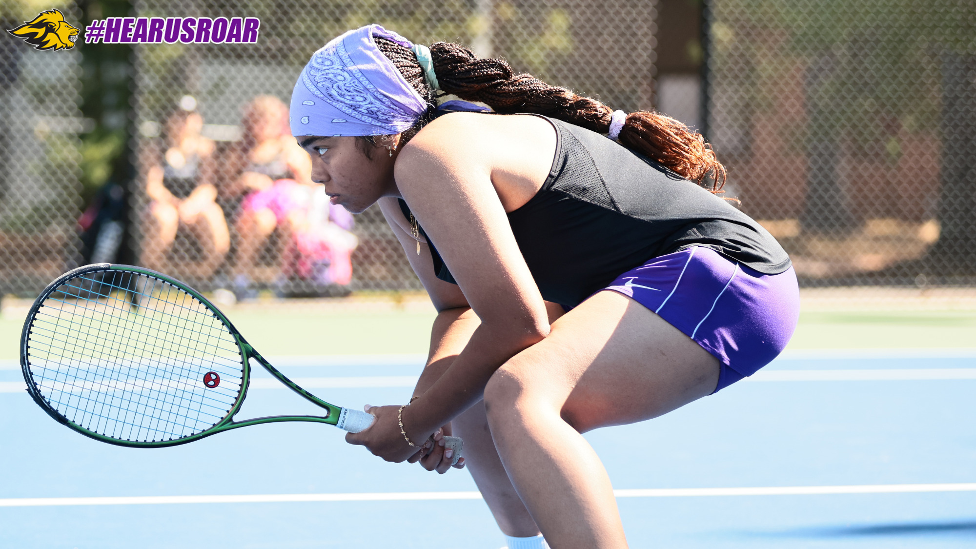 Gianna De-Reumante waits for the serve in doubles play at WellesleyGianna