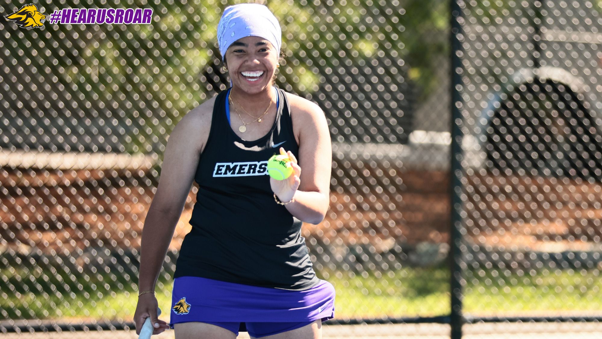 Gianna Di-Reumante smiles during her doubles match at Wellesley