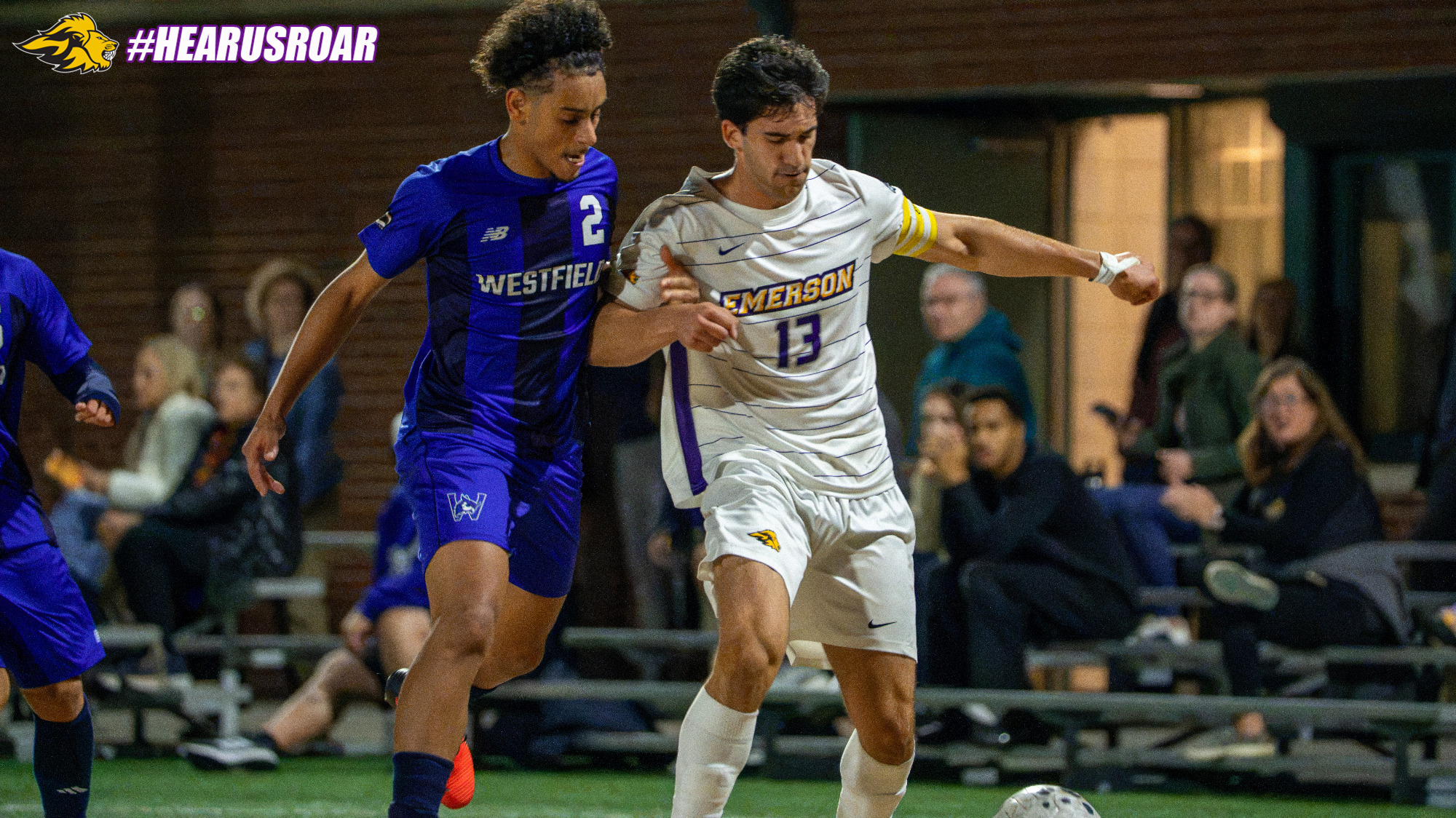 Nick Mirogiannis fends off a Westfield State defender