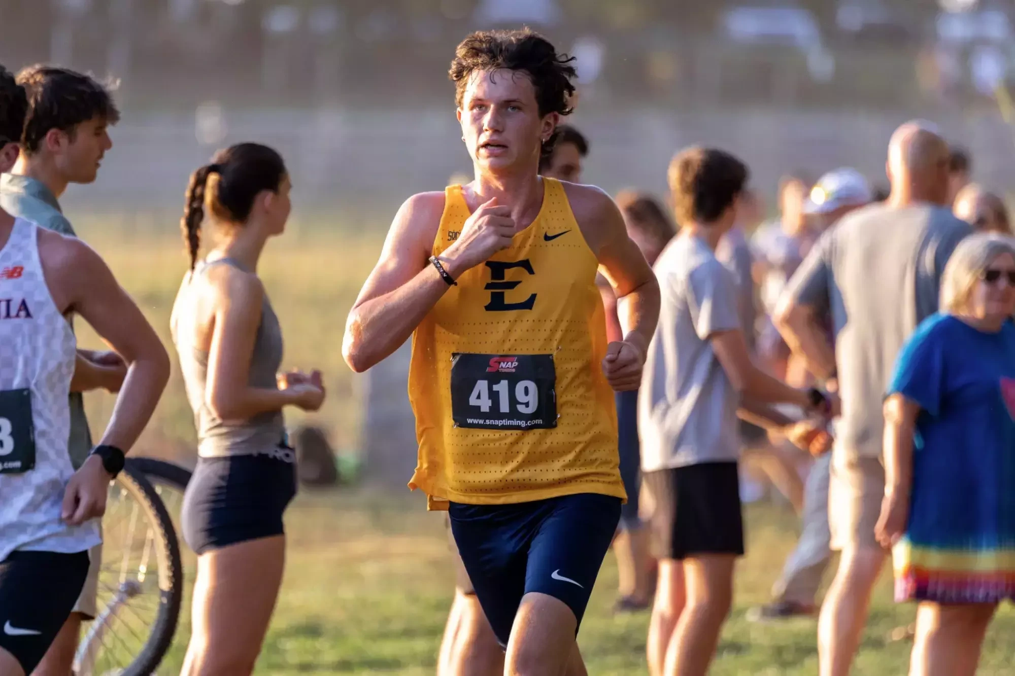 Hayden Waleski pushes himself toward the finish line of a cross country race in Blacksburg, Virginia.
