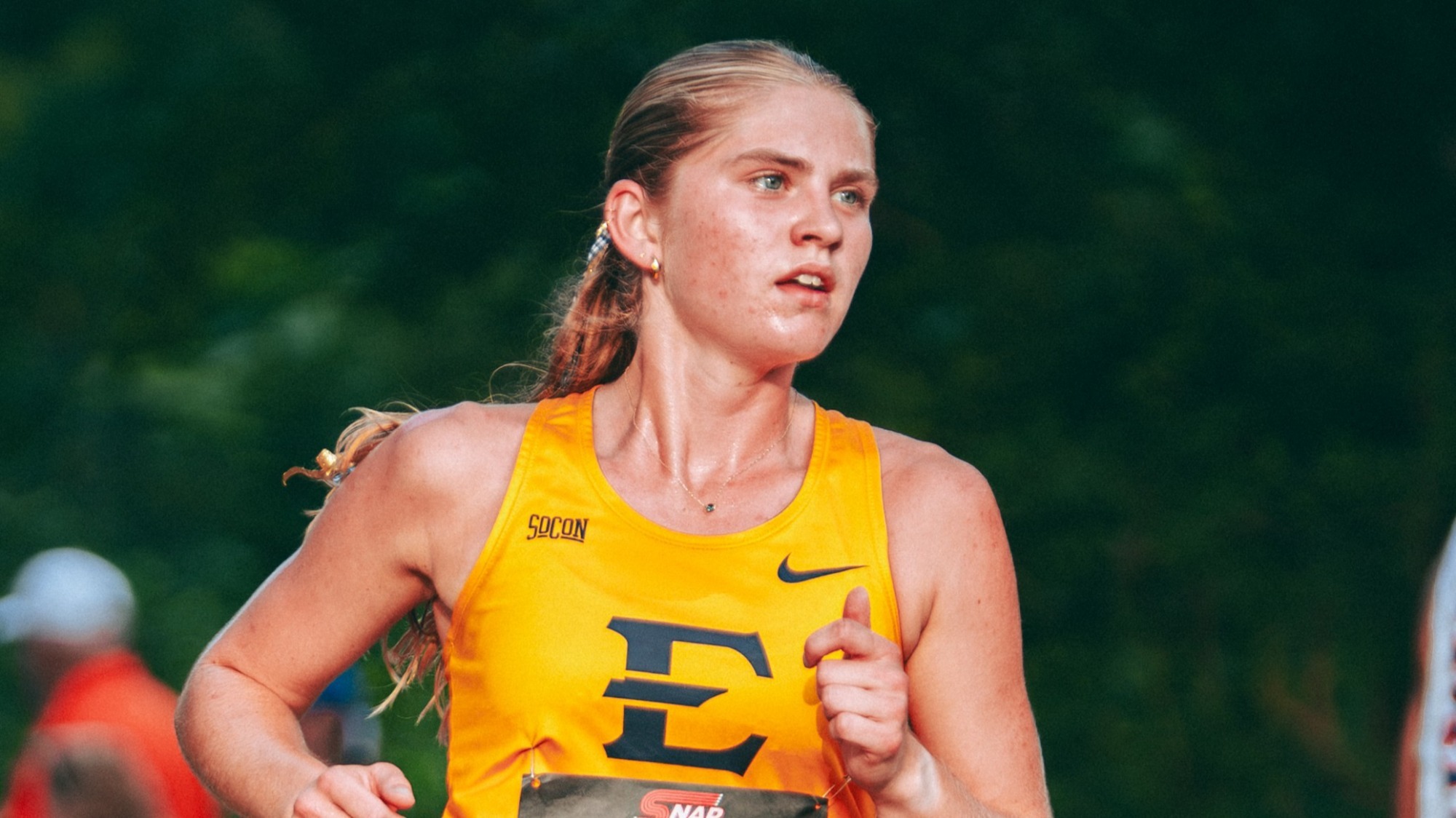 A medium shot of Deena Ludtke during a cross country race in Blacksburg, Virginia.