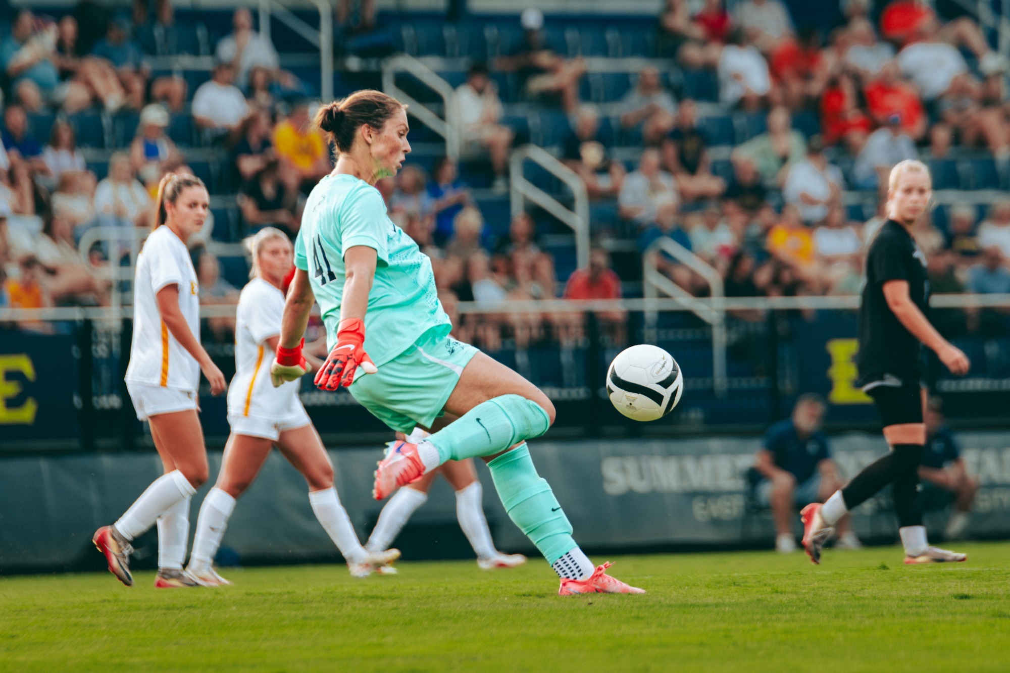 Addison Yelton releases the ball as she prepares to drop-kick it away from the goal she is defending during a soccer match against Mercer.