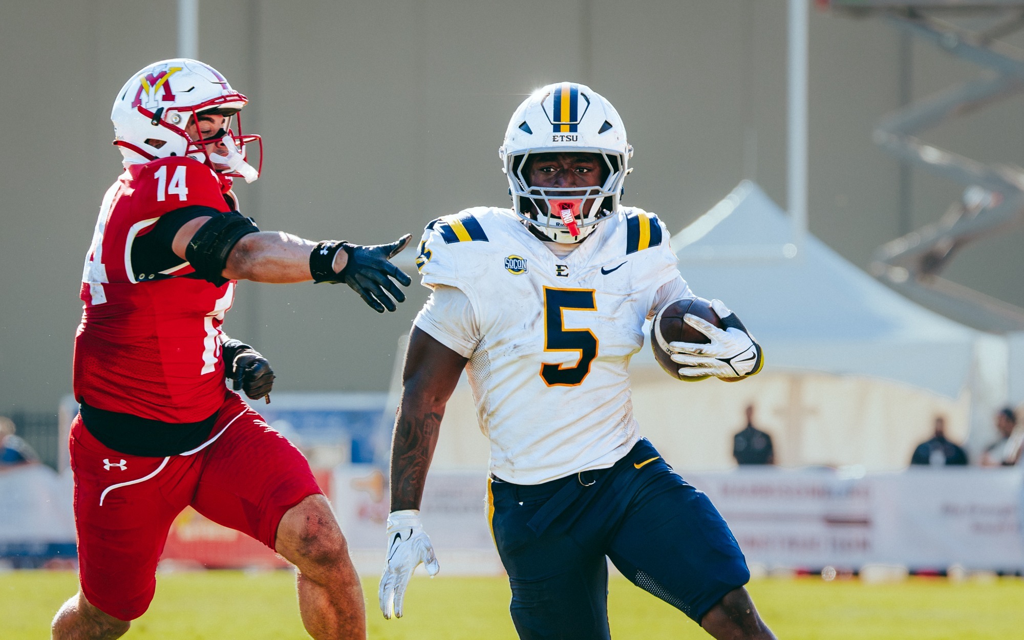 TJ Peyton runs the ball during a win for the Bucs against VMI