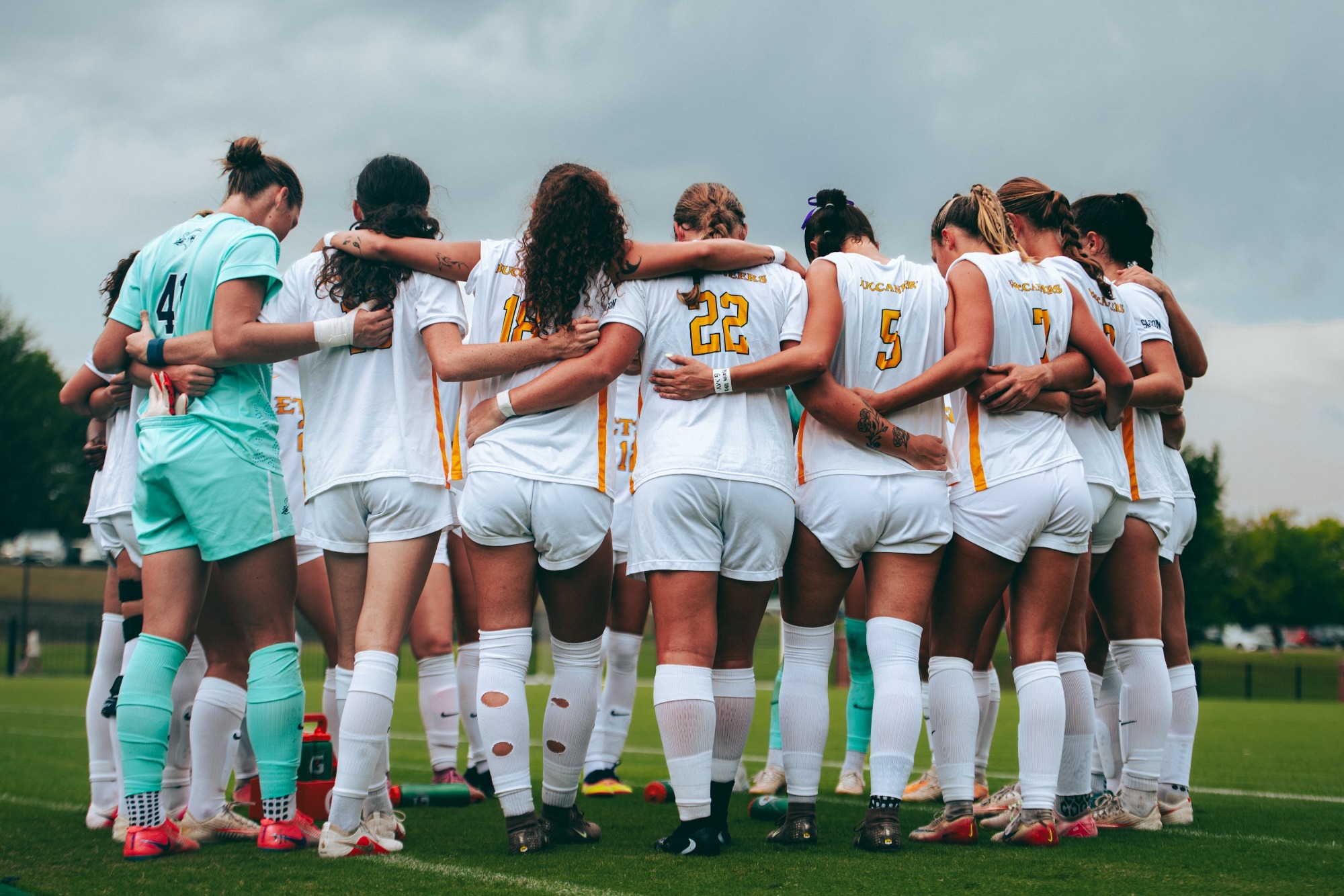 The ETSU women's soccer team huddles up before a soccer match against Mercer.