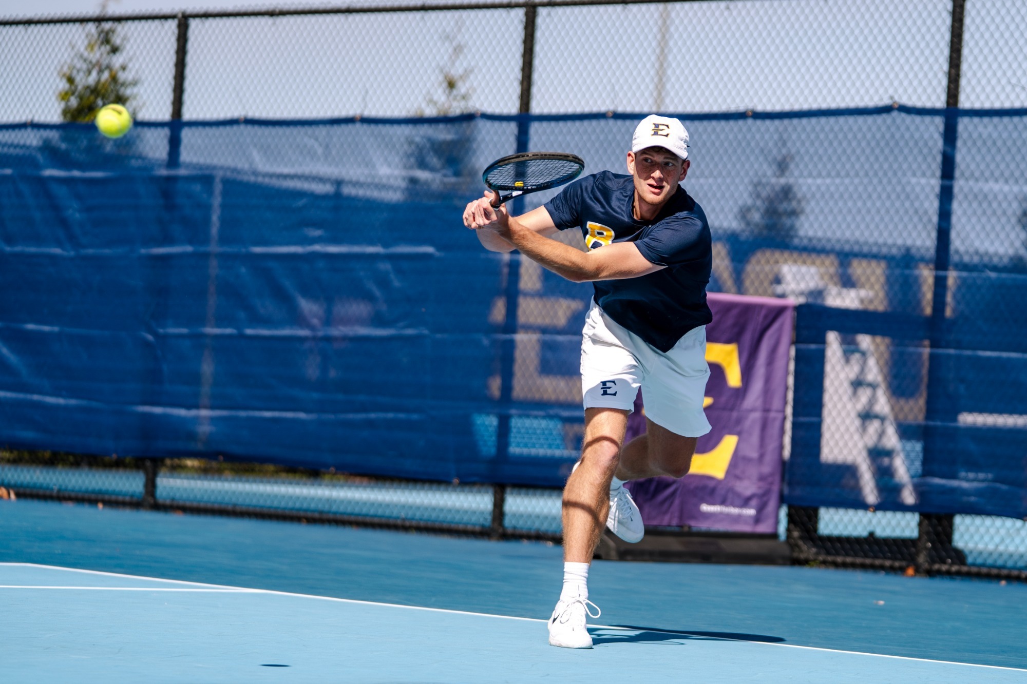 Peter Kalocsai returns a ball against Mercer