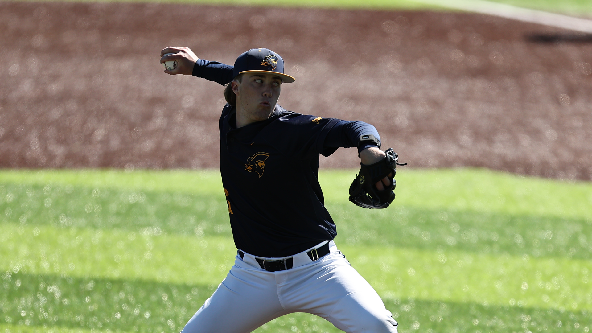 Michael Harpster throws a pitch against VMI