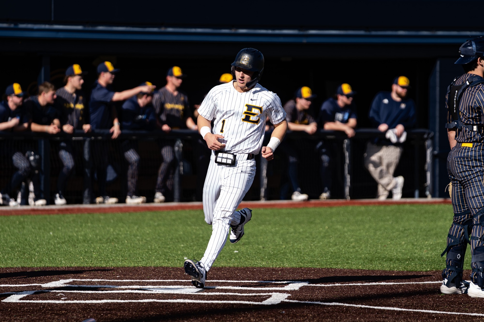 Jamie Palmese scores a run in a game against Quinnipiac