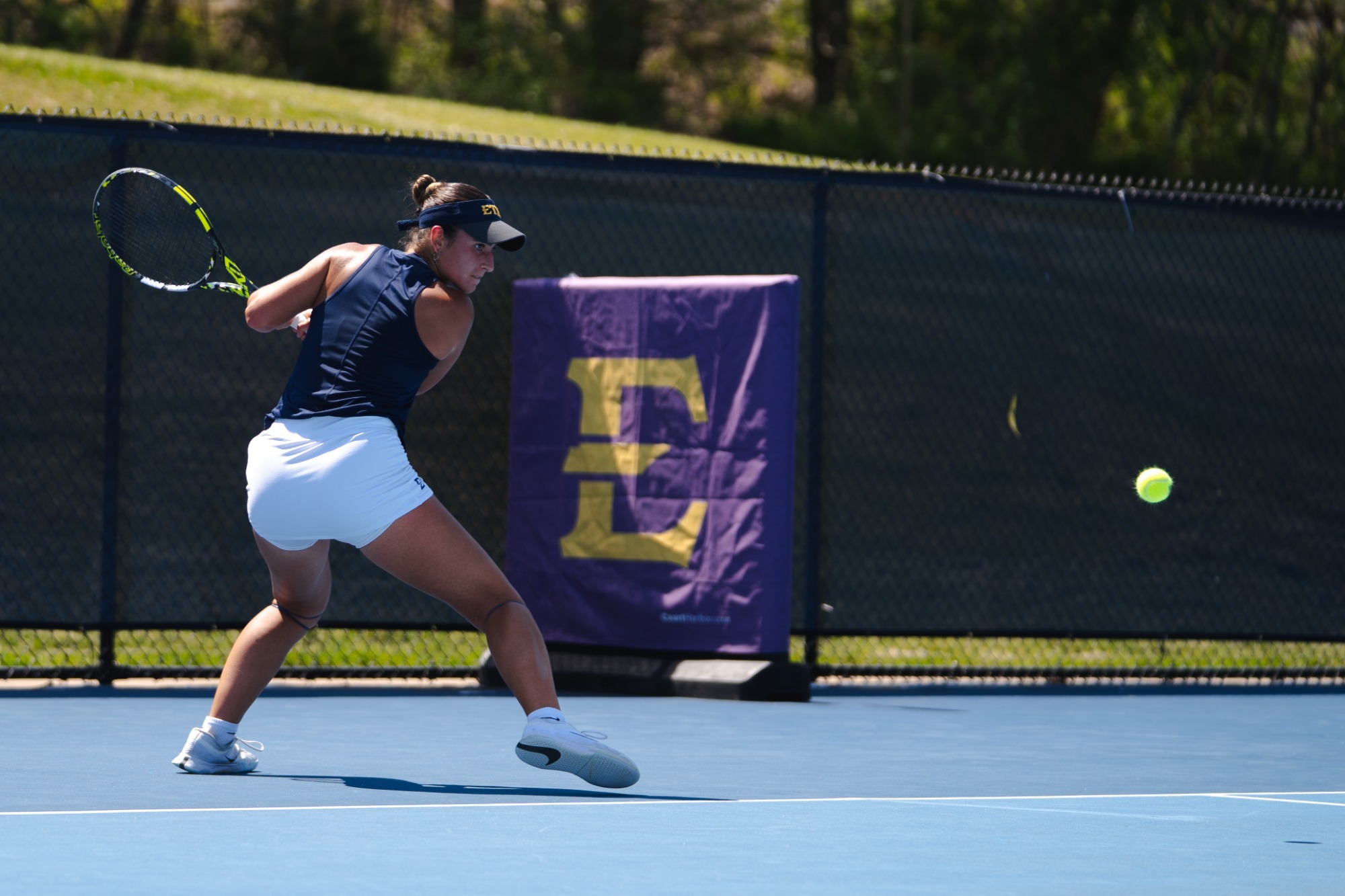 Julia Millan plays the ball in a match against No. 71 Furman