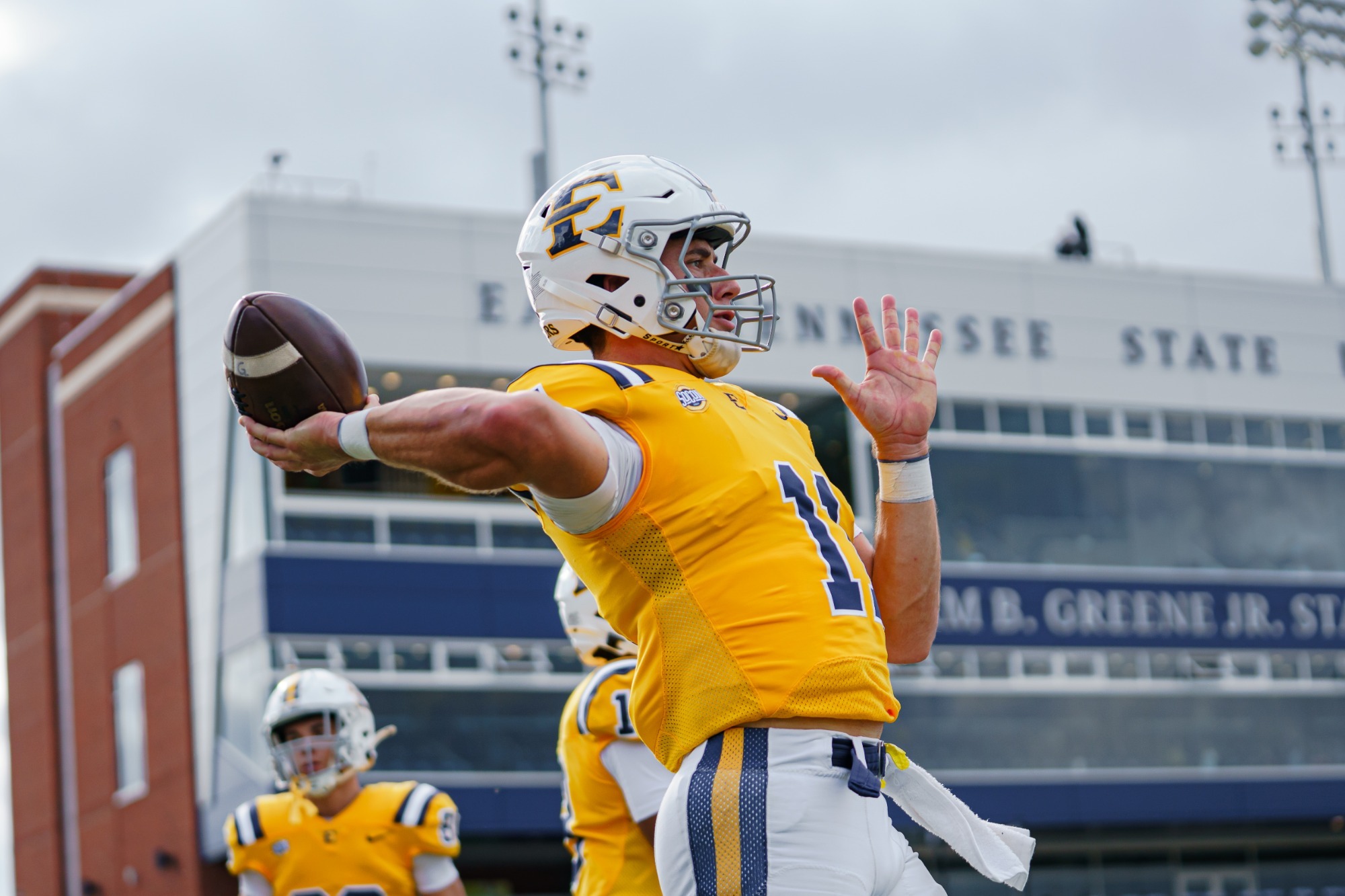 Cade McNamara warms up before a game against Mercer