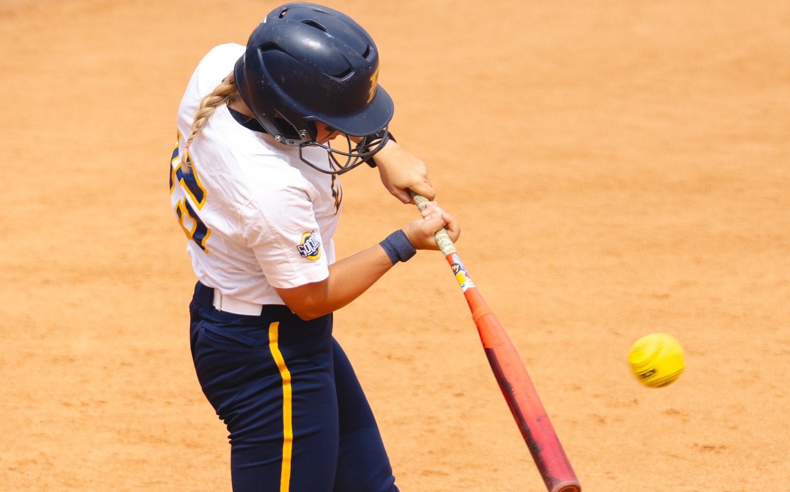 Softball's Hailey Porter making contact with a ball at the plate in the first game of a doubleheader versus Gardner-Webb on April 28, 2026.