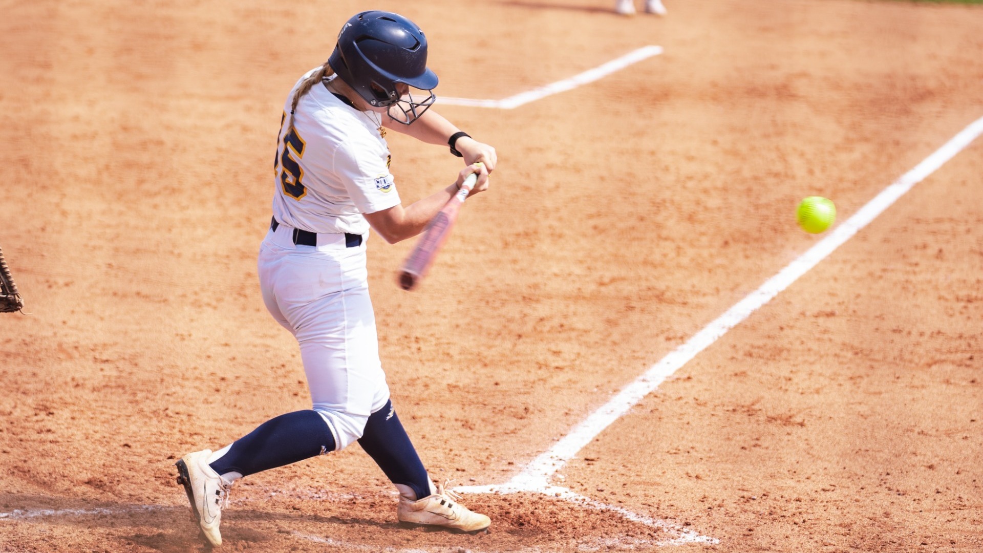 Softball's Hailey Porter making contact with a ball in the first game of the series vs. UNCG on March 21, 2026.