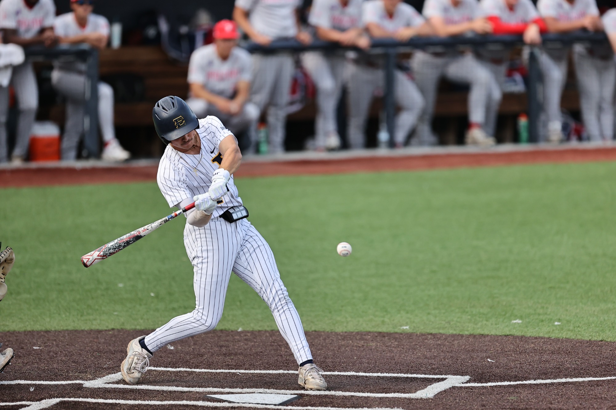 Henry Ferguson swings at a pitch in a game against Radford