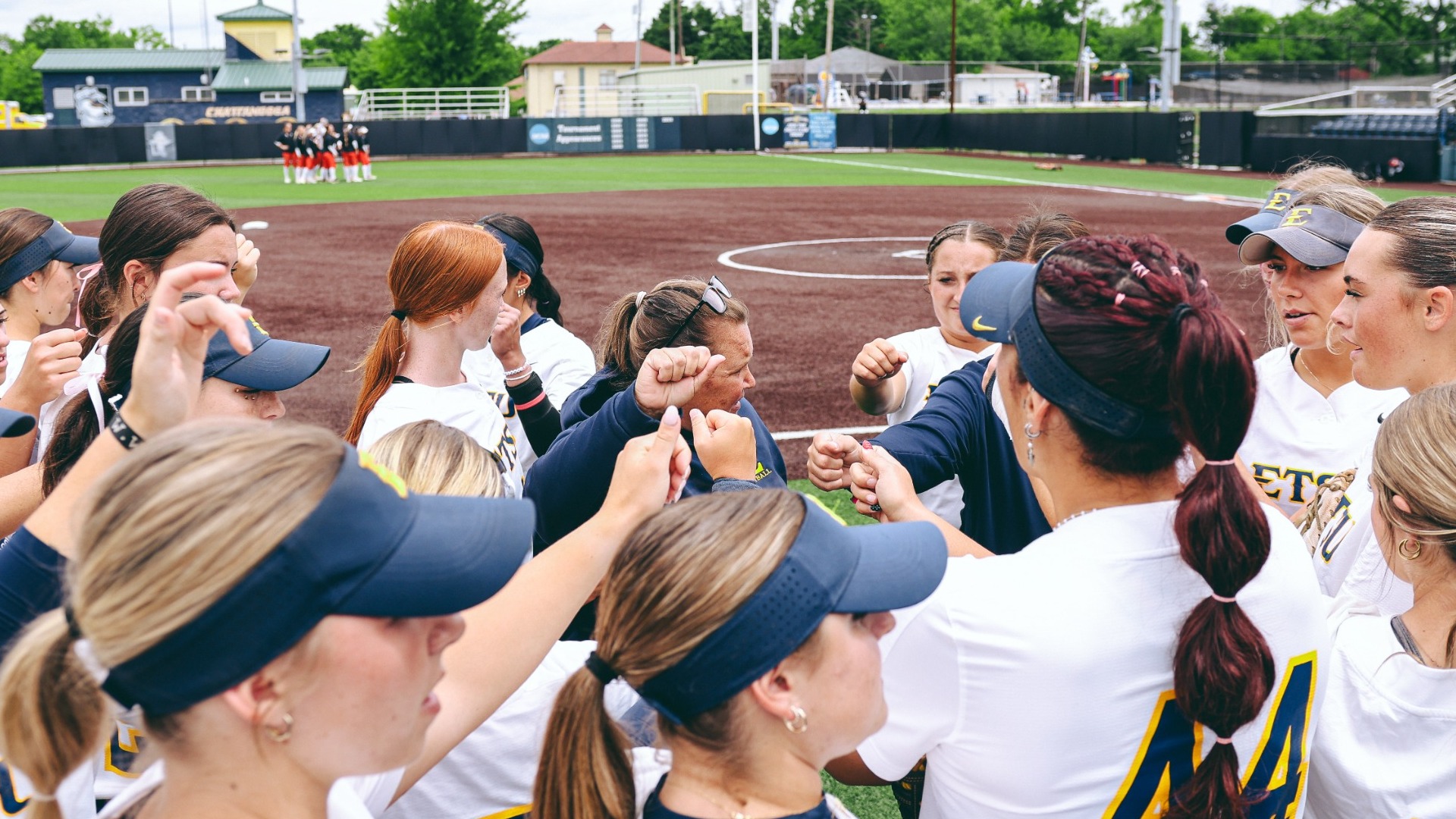 Softball standing in a huddle with their hands together pregame versus No. 7 seed Mercer in the SoCon Tournament on May 7, 2026.