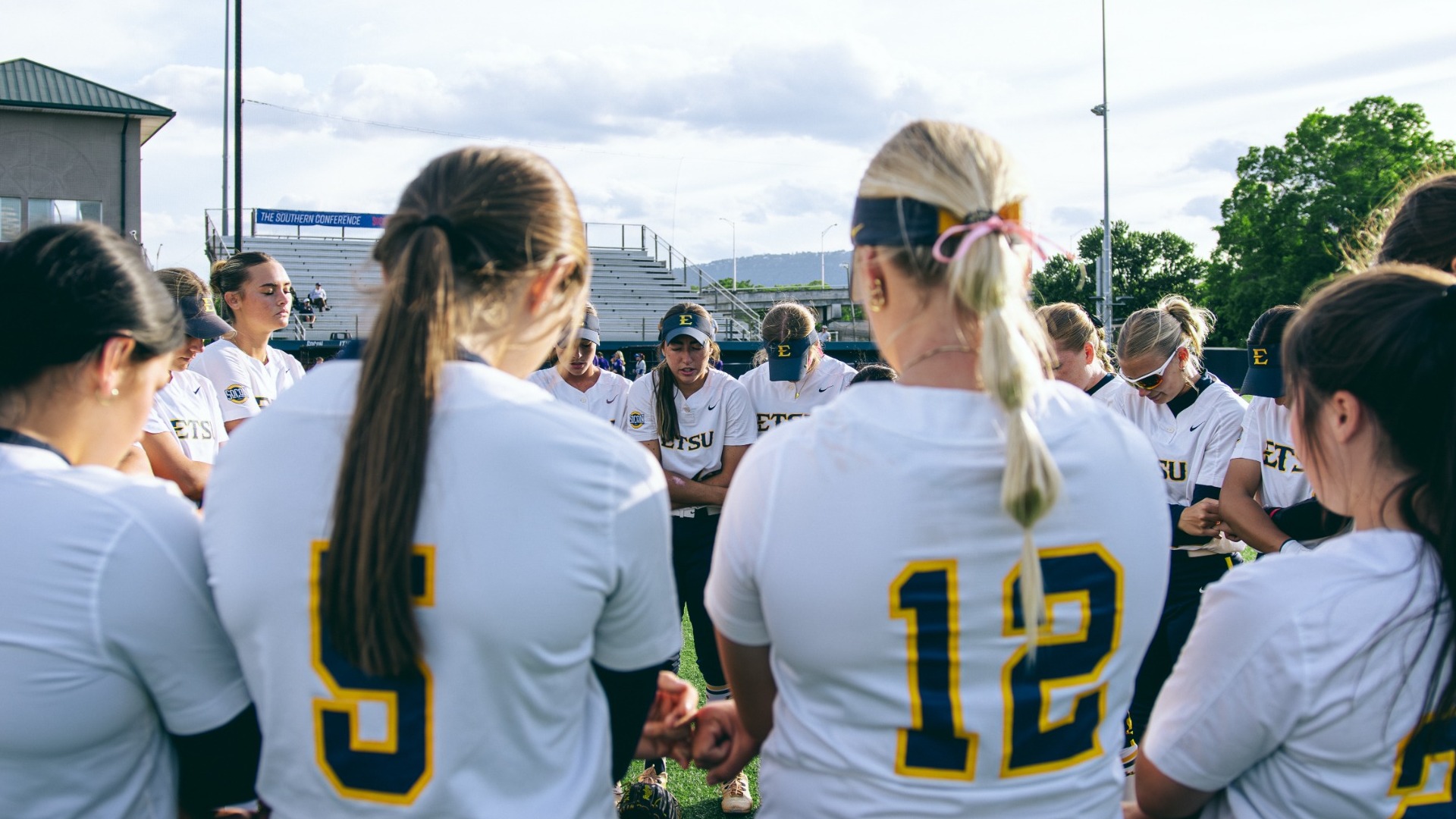Softball in a pregame prayer huddle prior to the start of game four versus No. 3 seed Western Carolina in the SoCon Tournament on May 7, 2026