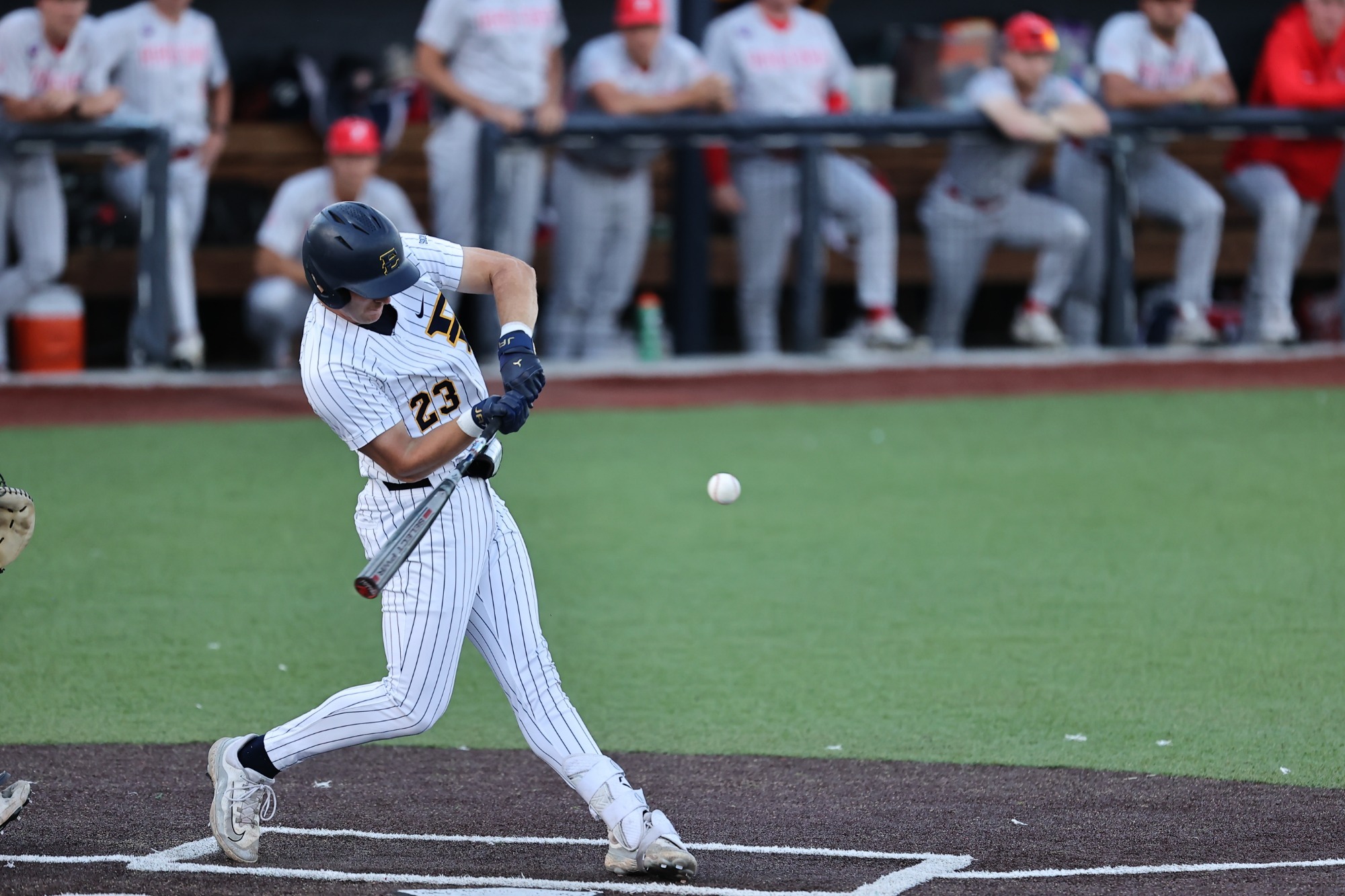 Andrew Hill swings at a pitch in a game against Radford