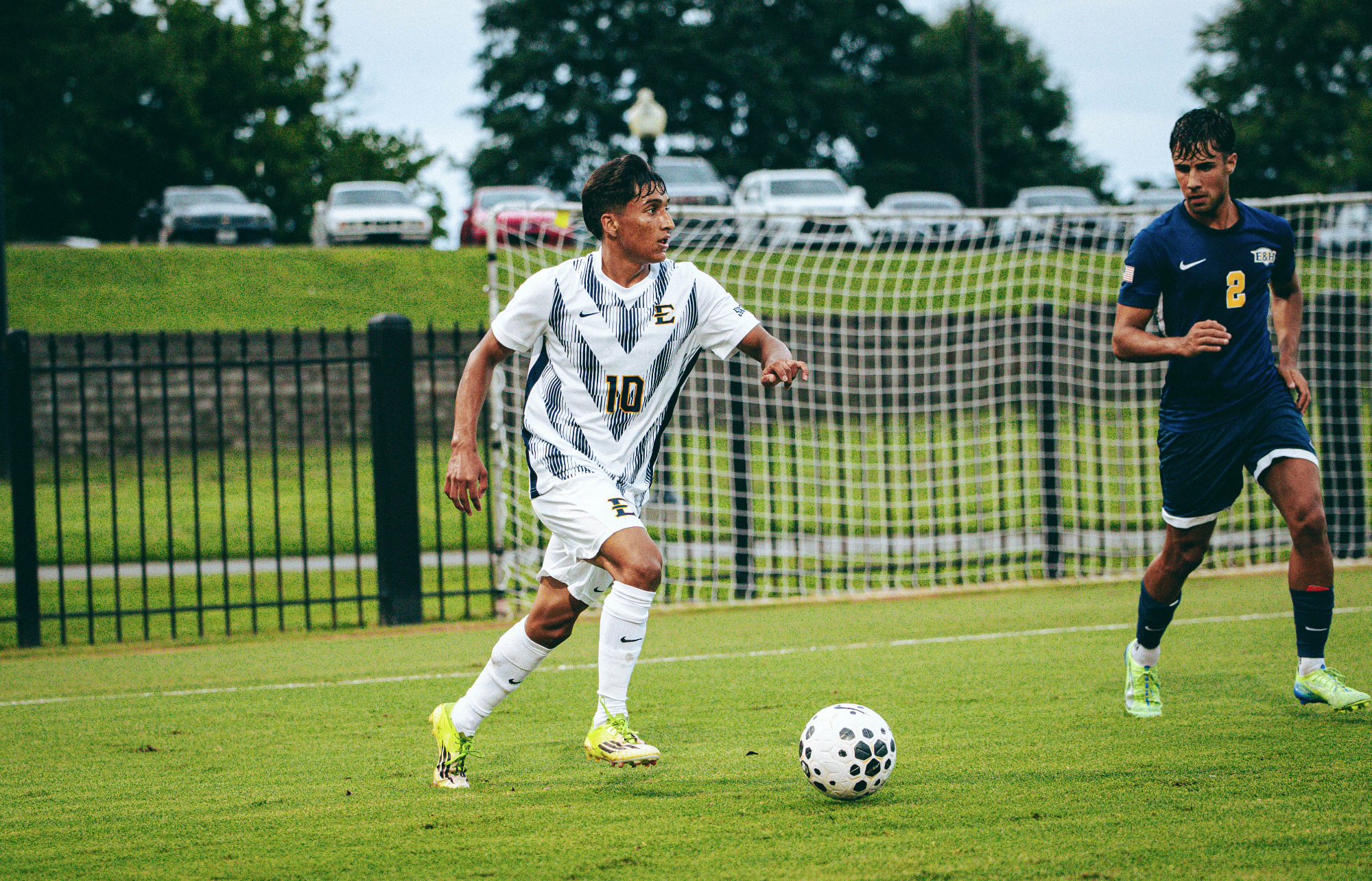 Jaime Carrillo runs away from an Emory & Henry defender during a match at Summers-Taylor Stadium.