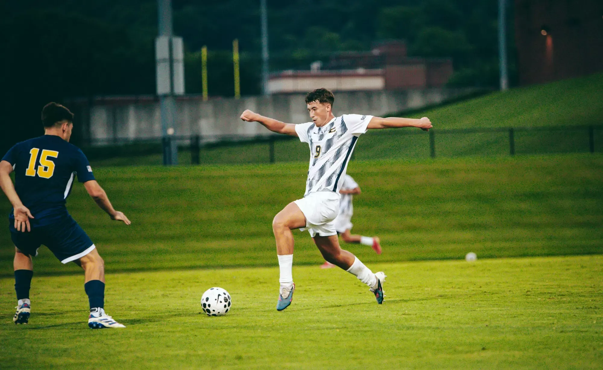 Gavin Dick takes a first touch and looks to settle the ball to attack in a soccer match against Emory & Henry.