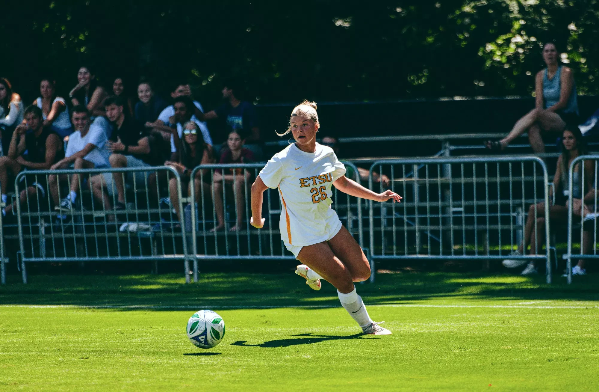 Ella Parker lines up a long pass during a soccer match at UNC Asheville.