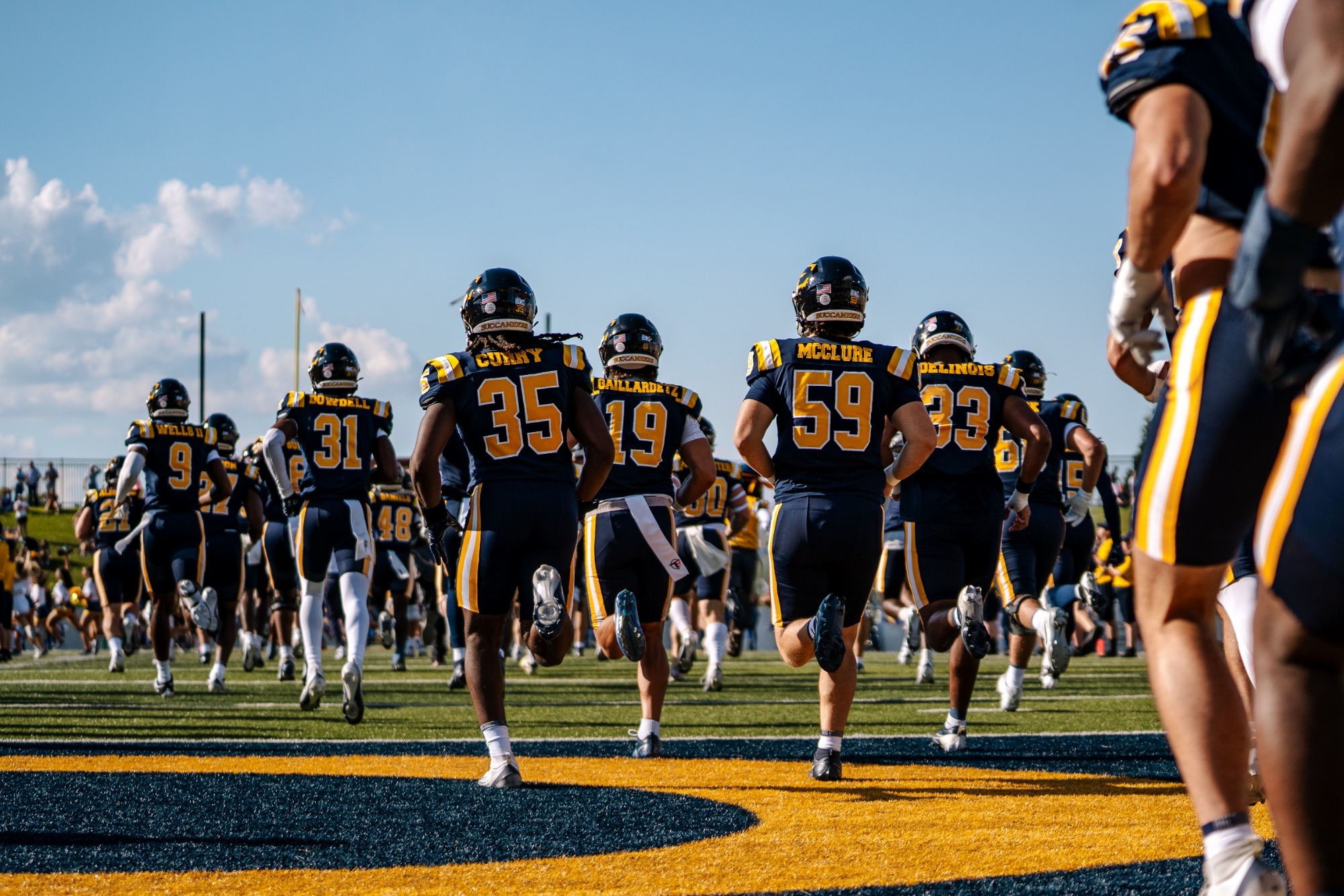 The 2025 ETSU Football team runs out prior to a game