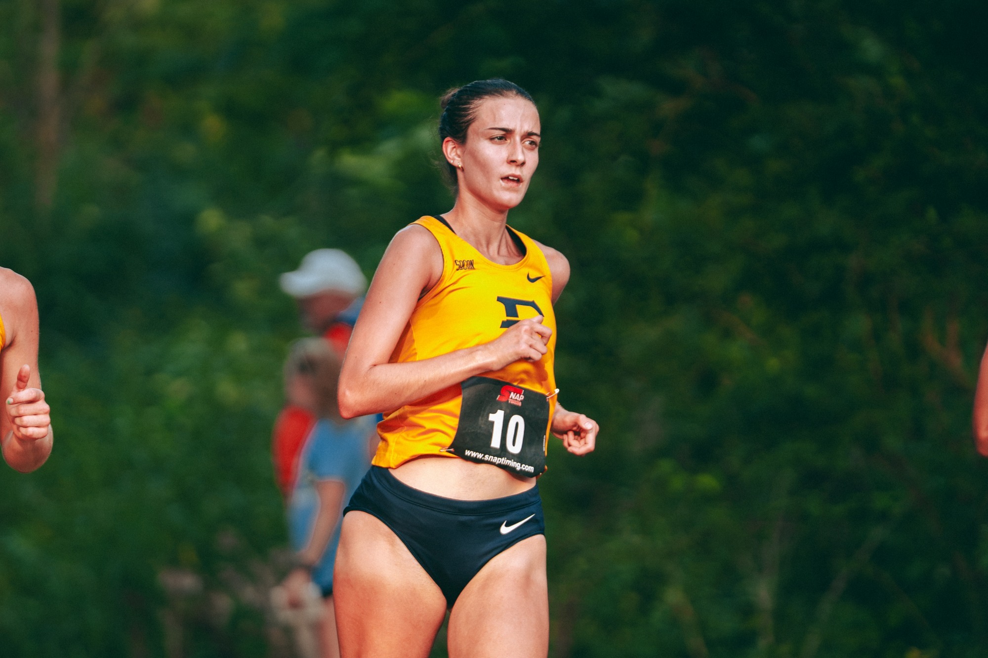 Mackenzie Armstrong crests a hill during a cross country race in Blacksburg, Virginia.
