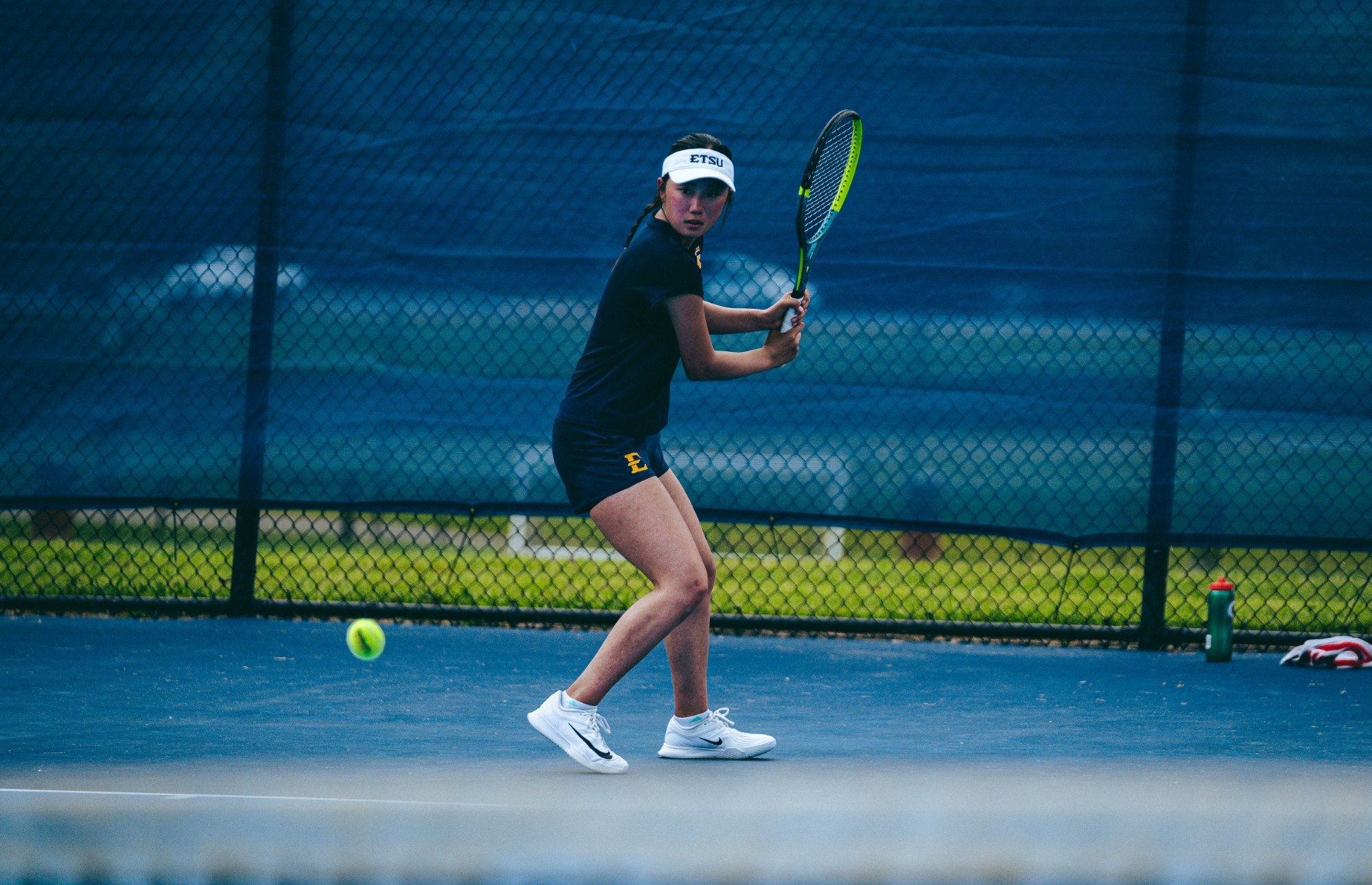 Uta Asakura swings a racket in a practice