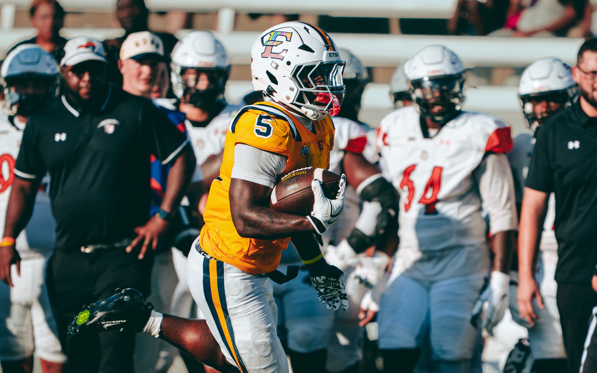 TJ Peyton runs the ball in a game against Tusculum