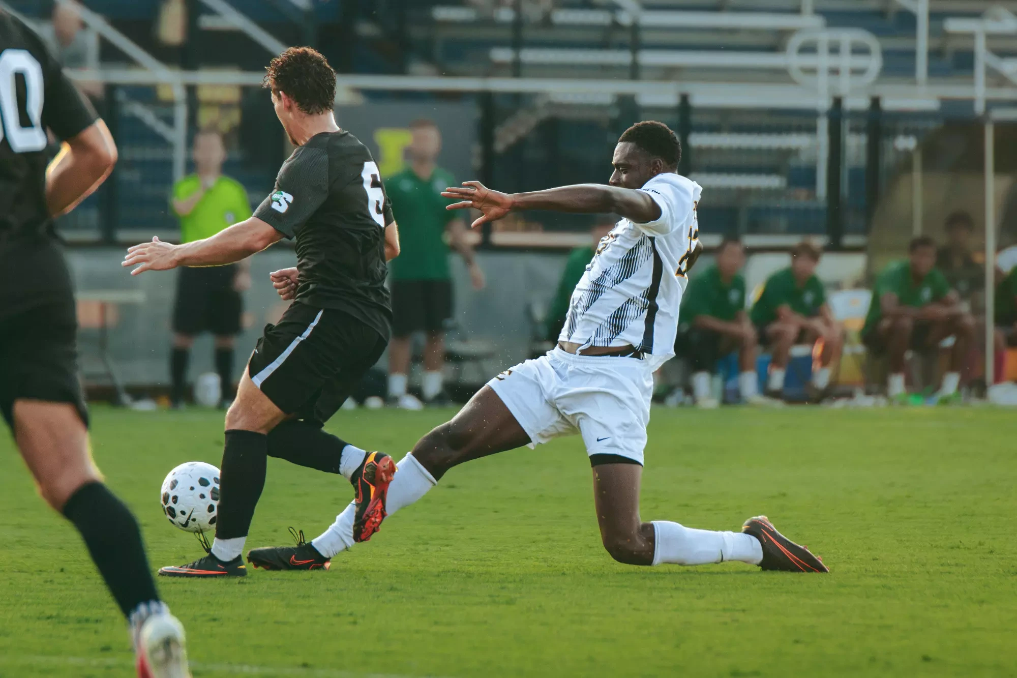 George Chunuwe extends his right leg for a sliding tackle against USC Upstate.